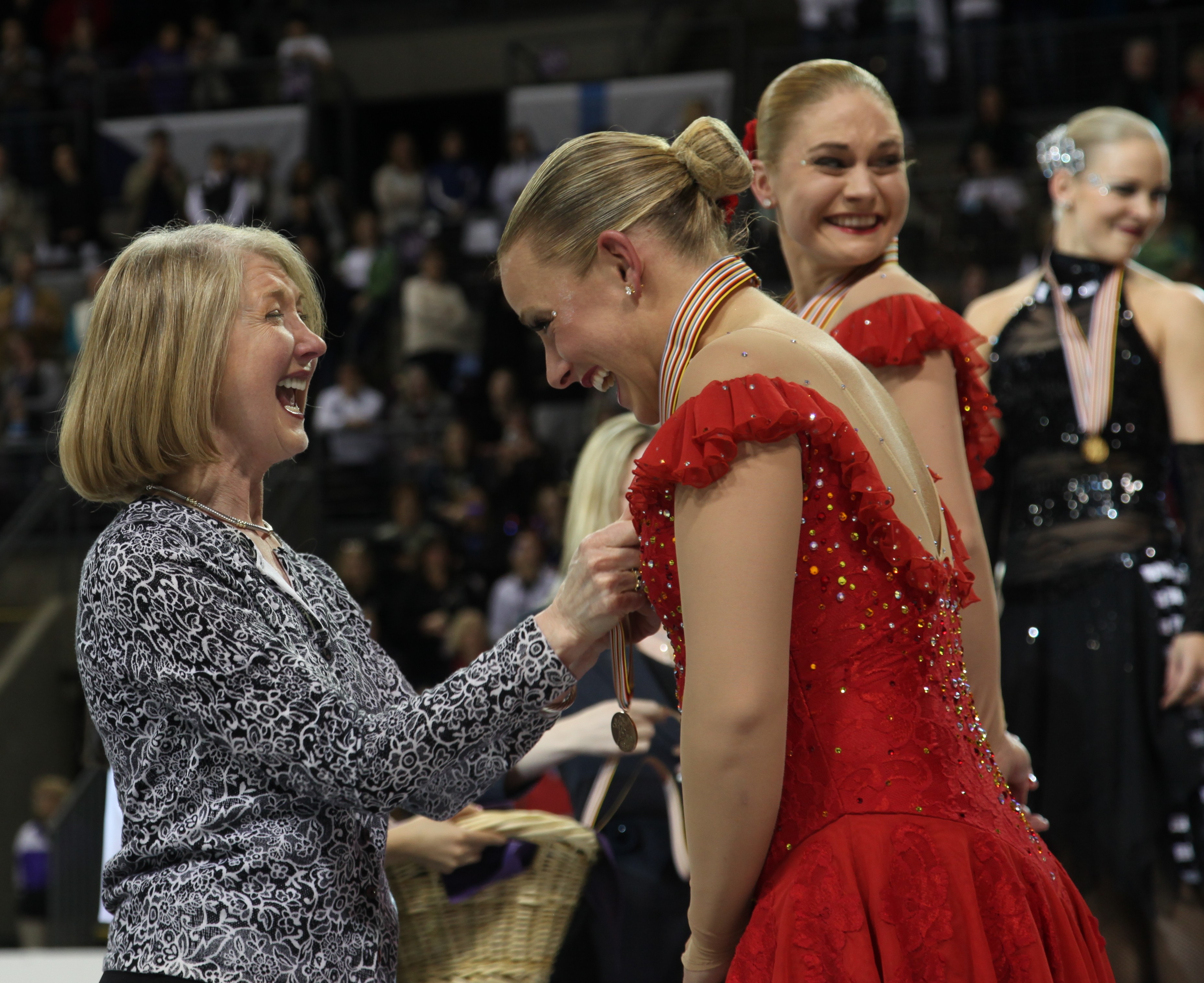 Lynn Benson presents the first World medals ever won by a U.S. team at the 2010 World Synchronized Skating Championships.