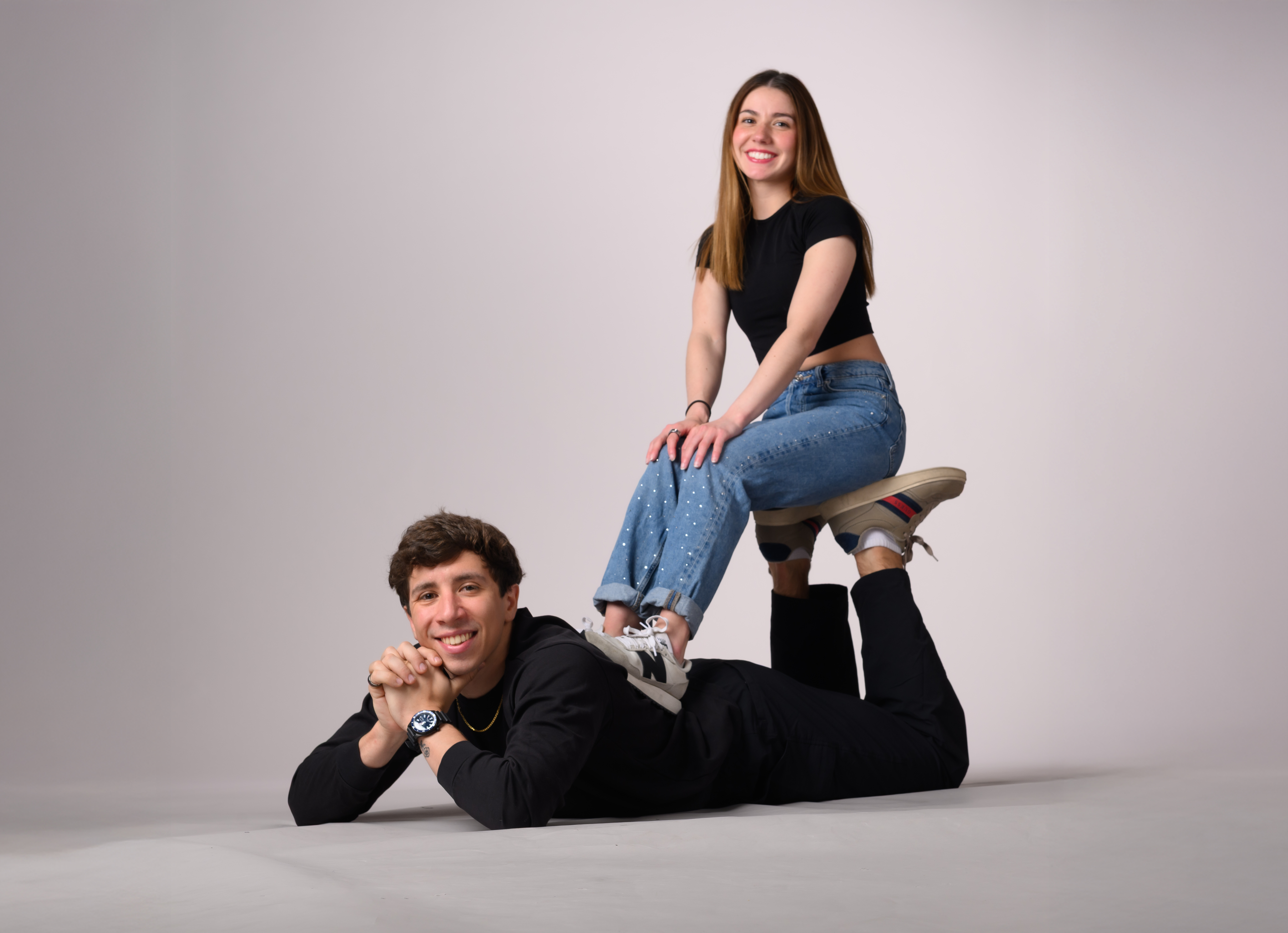 Valentina Plazas rests on the legs of Maximilano Fernandez during a Champs Camp photo shoot.