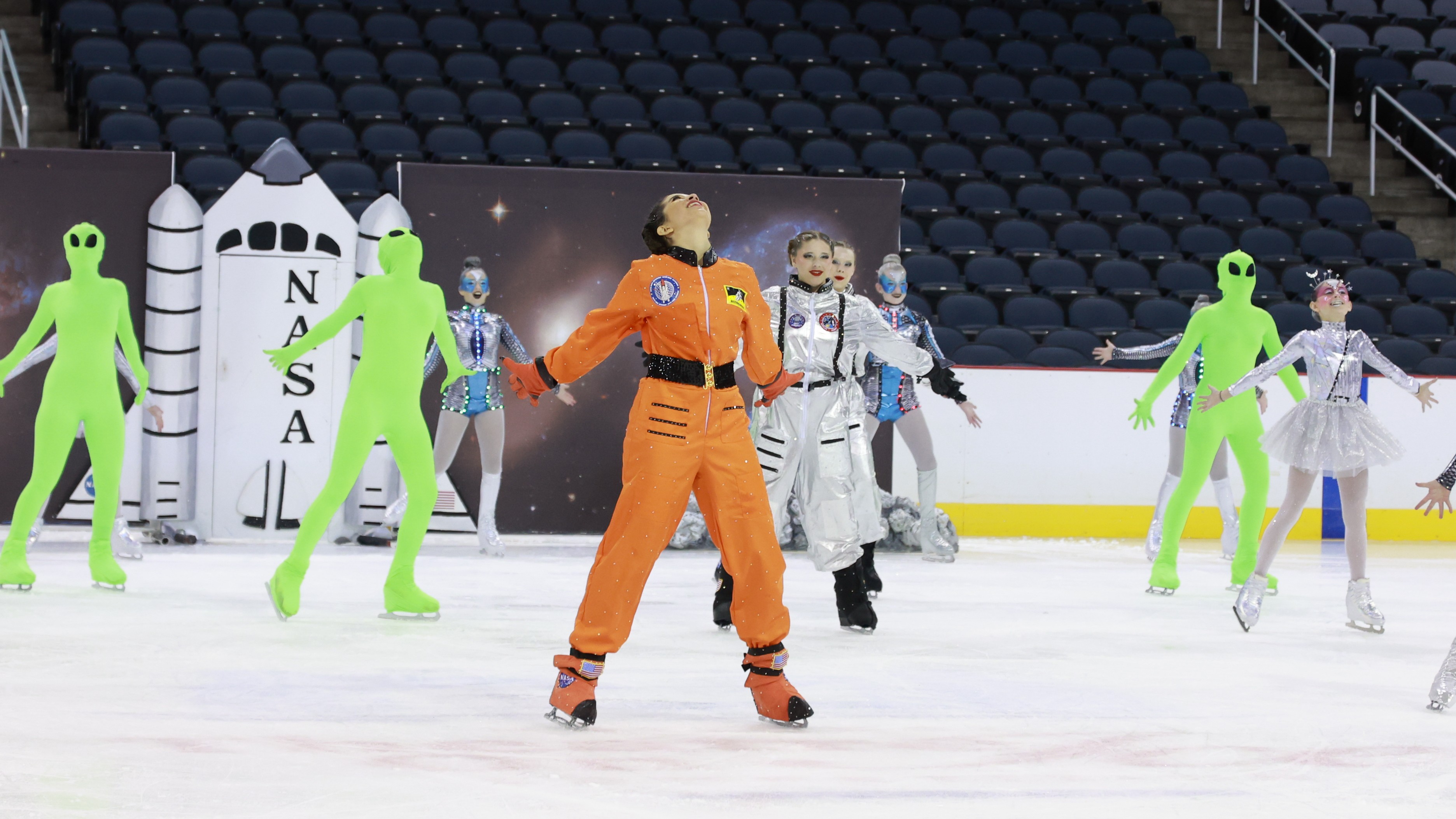 A NASA astronaut and green aliens are portrayed by the juvenile Space Coast Hurricanes.