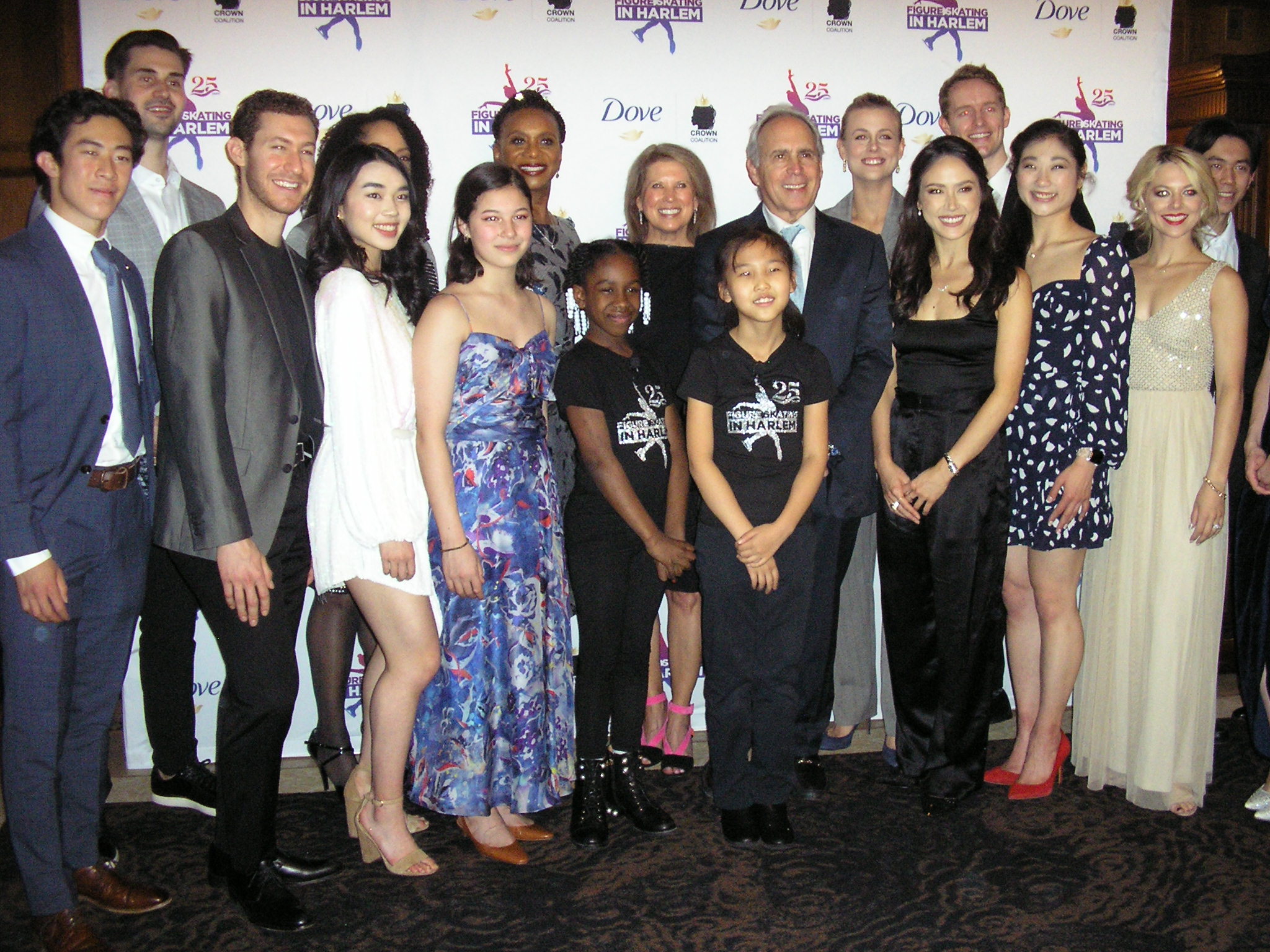 Figure Skating in Harlem board members with figure skaters, including Alysa Liu, Madison Chock, Evan Bates, Alexa Knierim, Karen Chen, Nathan Chen, Vincent Zhou and Zachary Donohue.