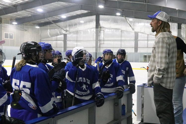 Chad Fain leads the local high school hockey team.