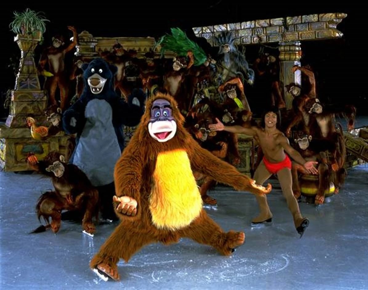 Gig Siruno, right, poses as Mowgli from the Jungle Book for Disney on Ice and poses alongside the other characters from the story on ice