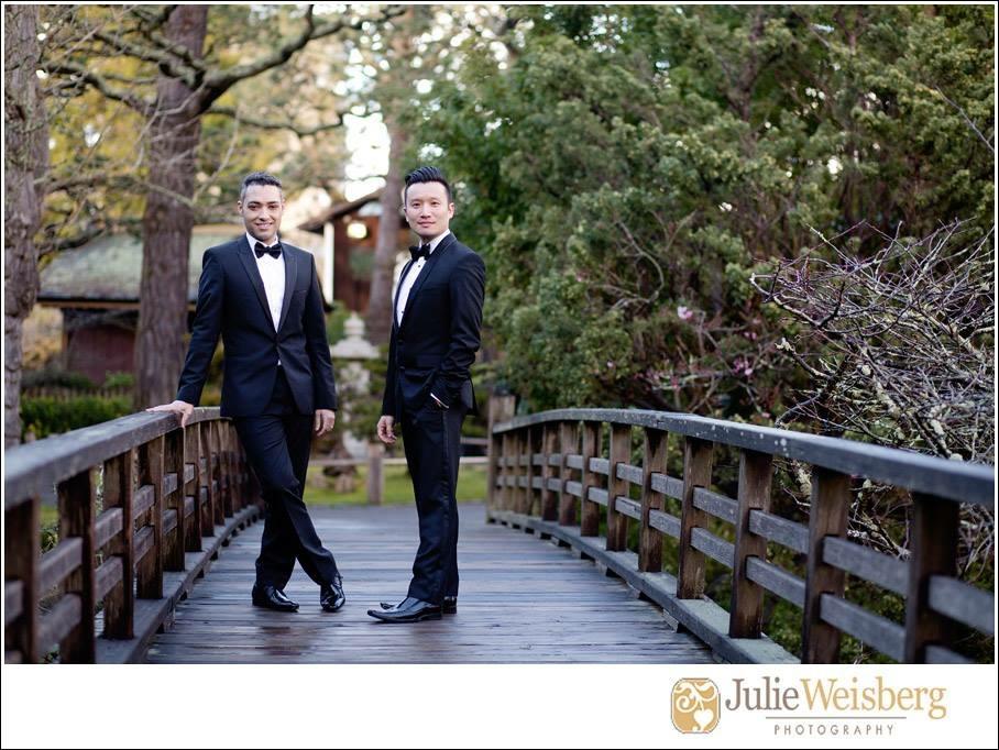 Delmore and husband Kenneth Leong outside together in tuxedos.
