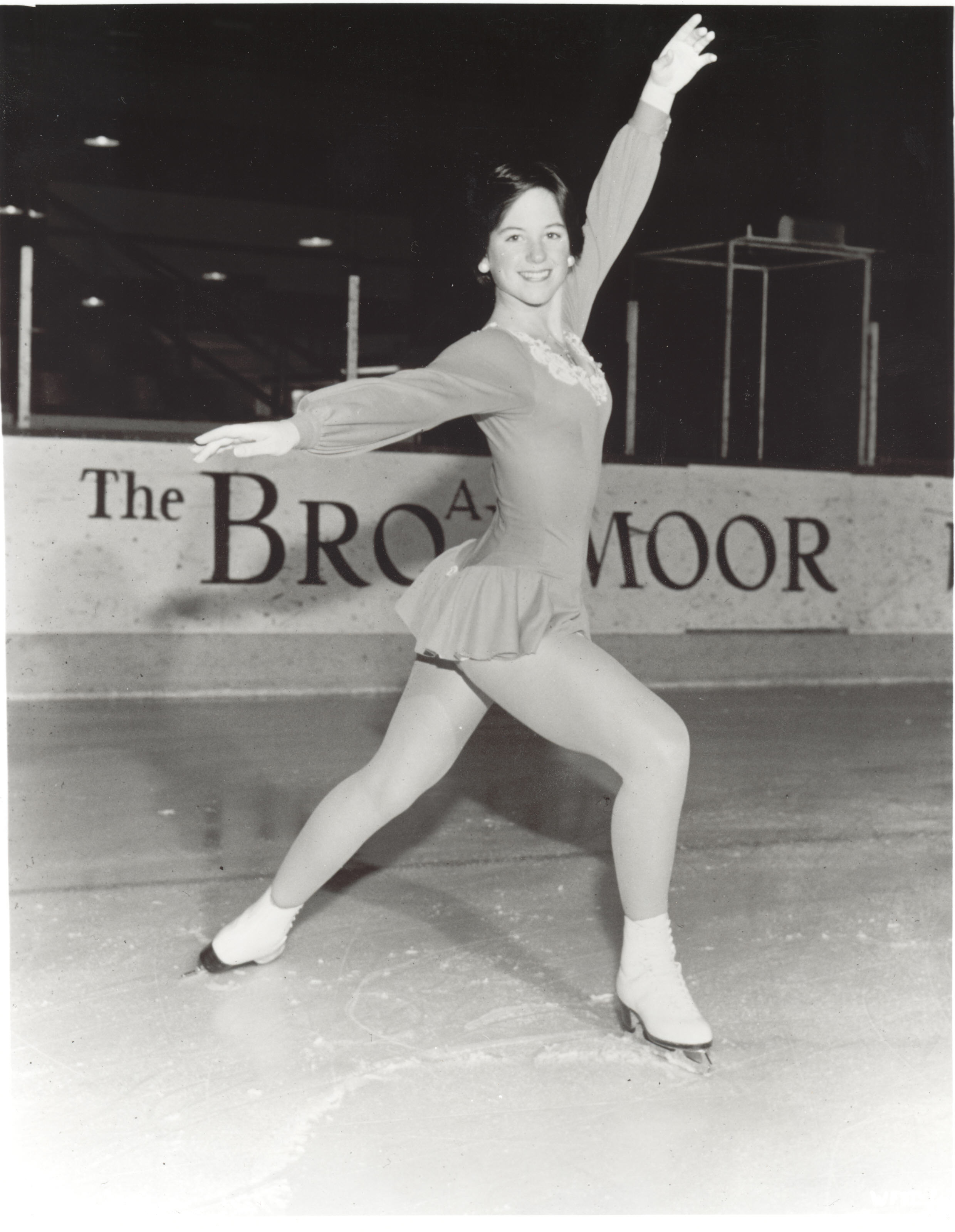 Dorothy Hamill poses in a starting position in a black and white photo at the Broadmoor World Arena.