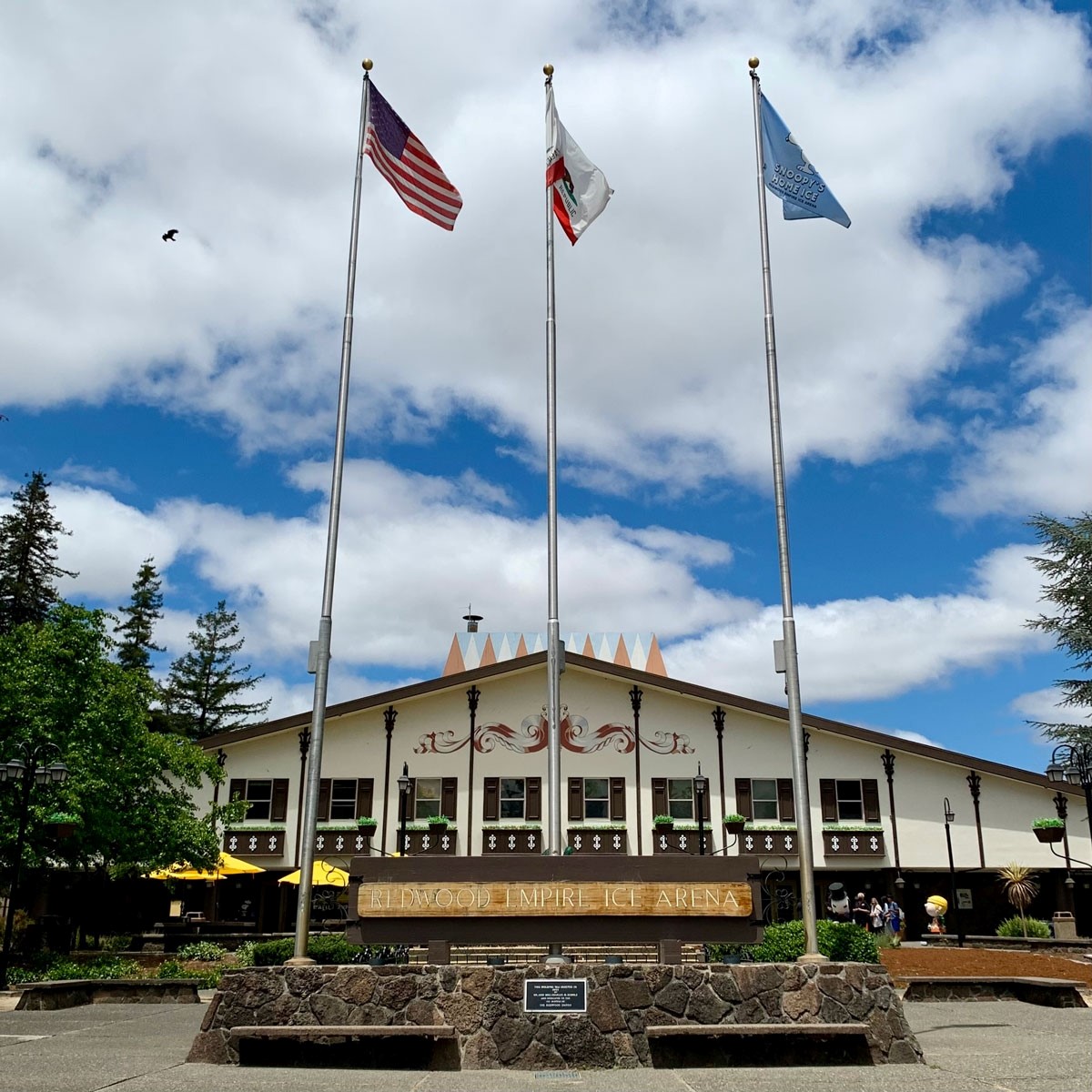 The majestic exterior of Snoopy's Ice House, with flags flying.