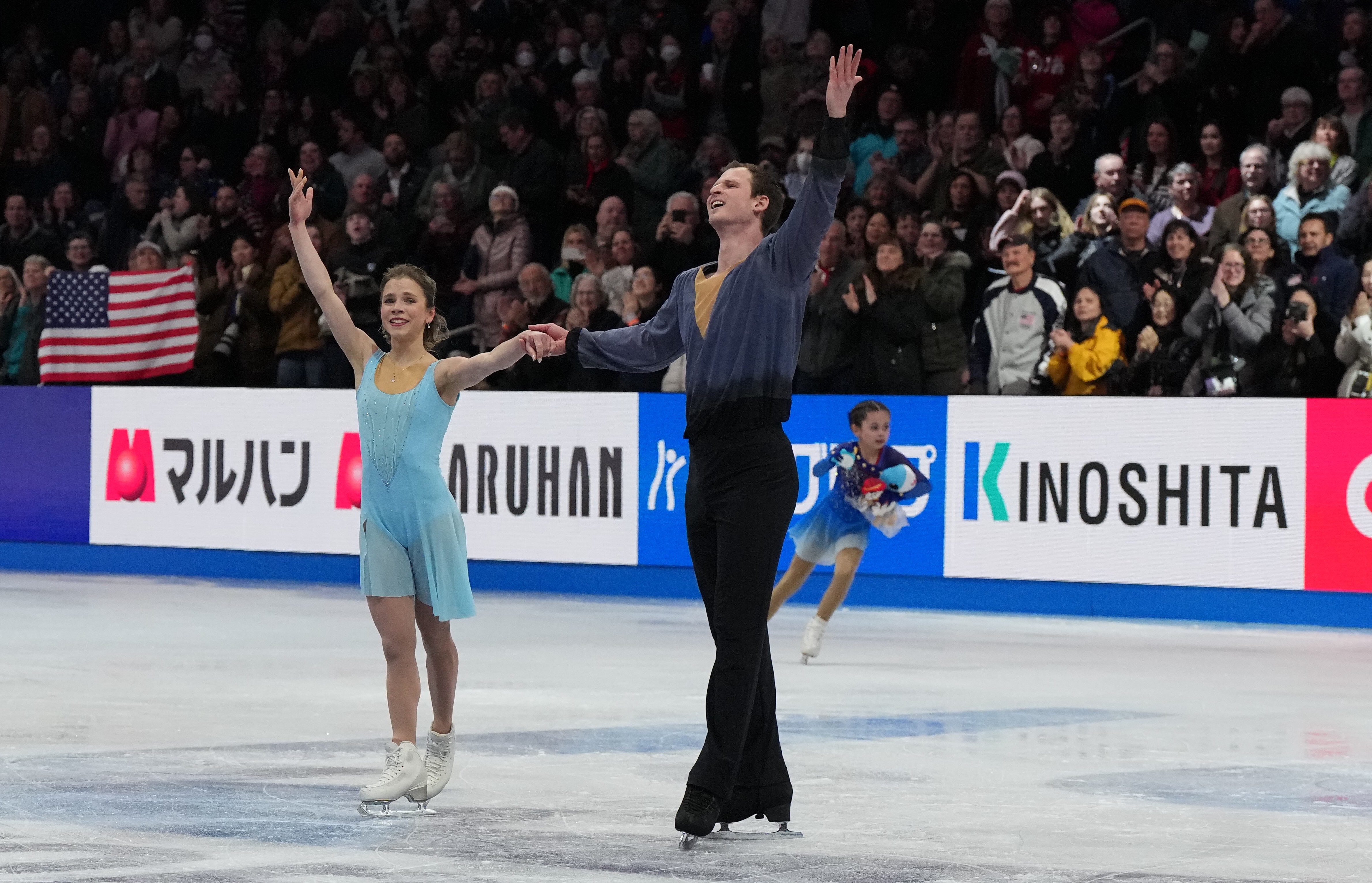 Alisa Efimova and Misha Mitrofanov salute the crowd after their free skate at Worlds.