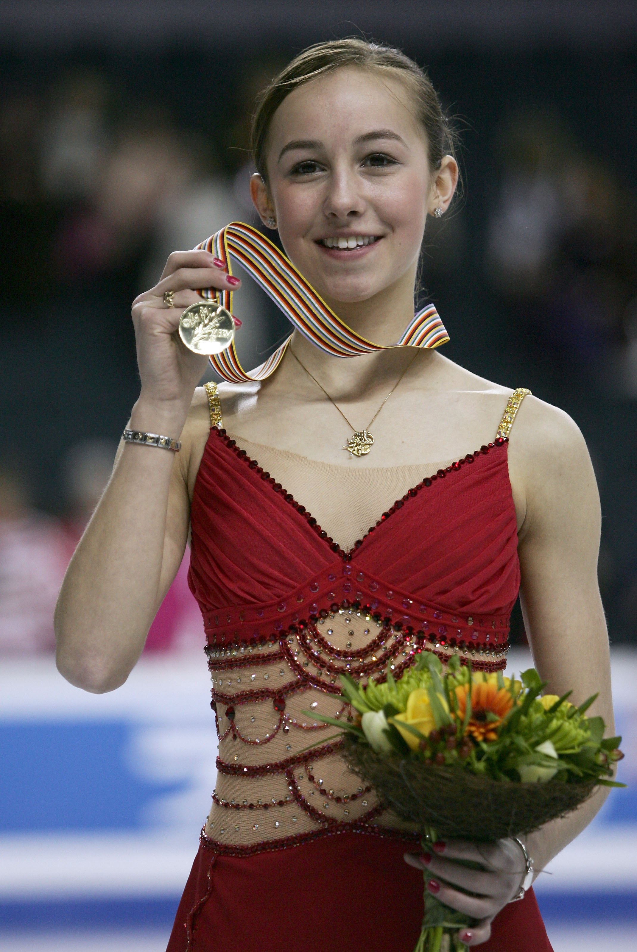 Kimmie Meissner wears the gold medal at the World Championships.