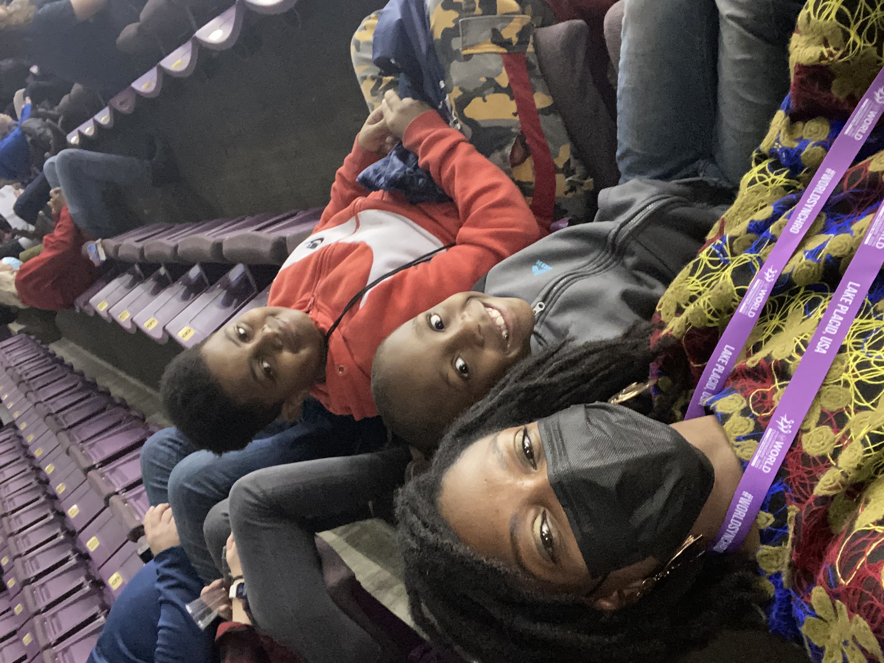 Kadari Taylor-Watson in the stands of Broadmoor World Arena with a few local community members.