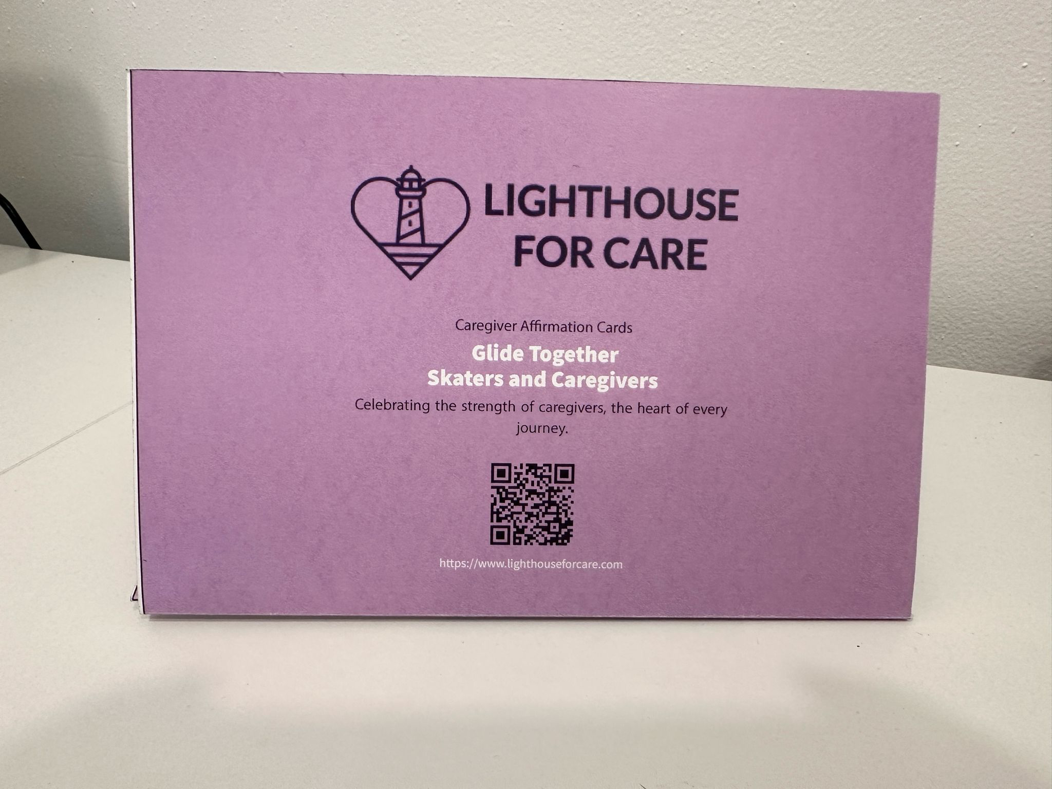 A pink box with the words Lighthouse for Care /Caregiver affirmation cards on the cover