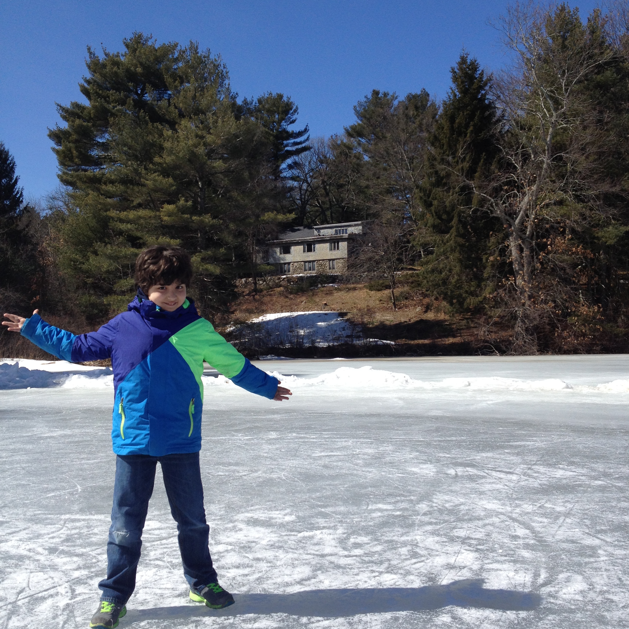 Sobell's son stands on the frozen pond.