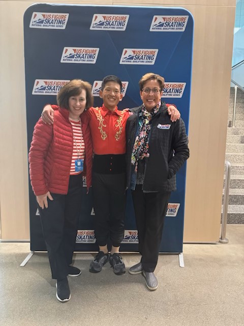 Skater Archie Schuster, with Kathleen Gazich, left, and Loni Keenan at a National Qualifying Series event.