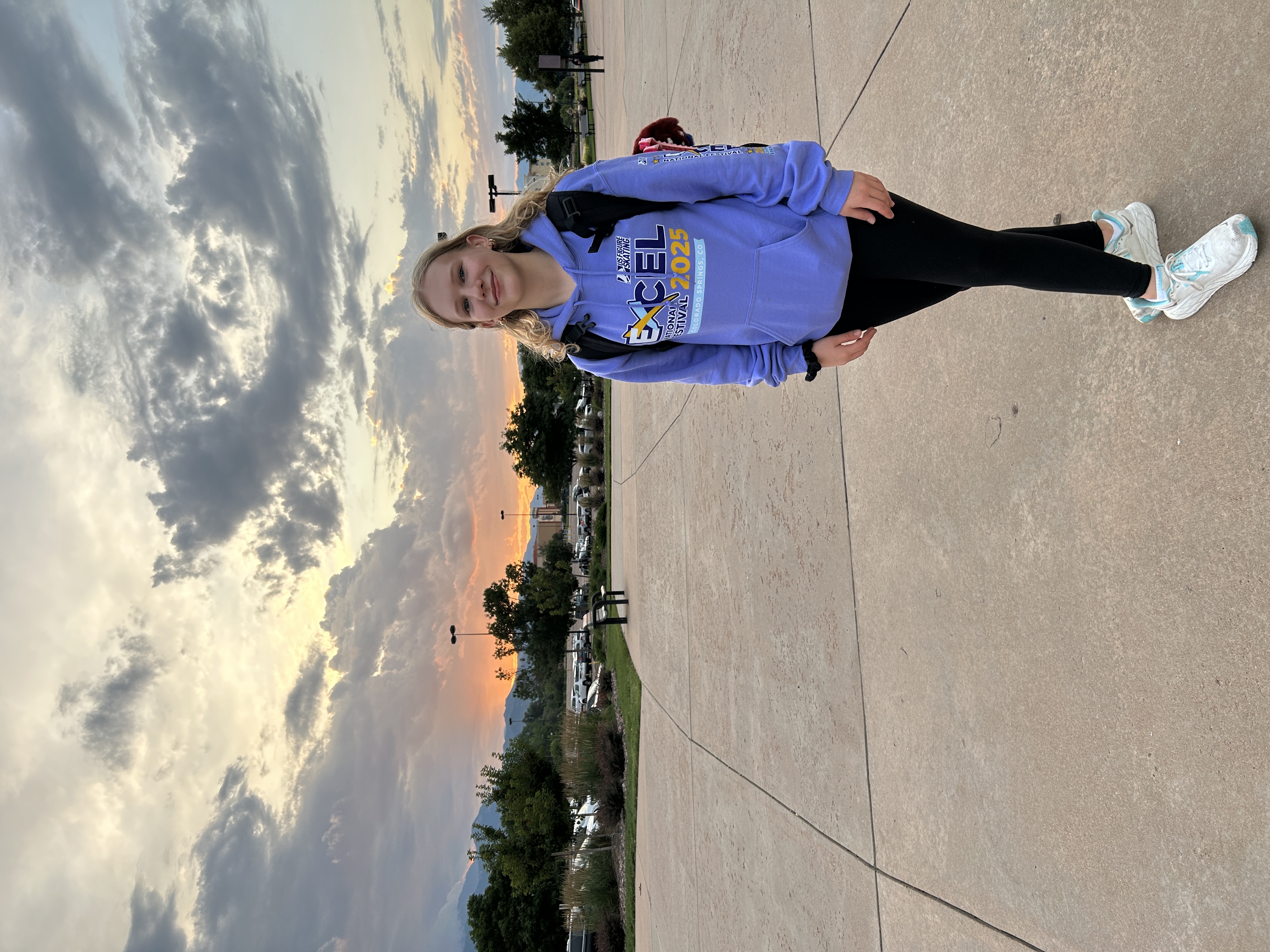 Charlotte Anderson in a light purple Excel sweatshirt