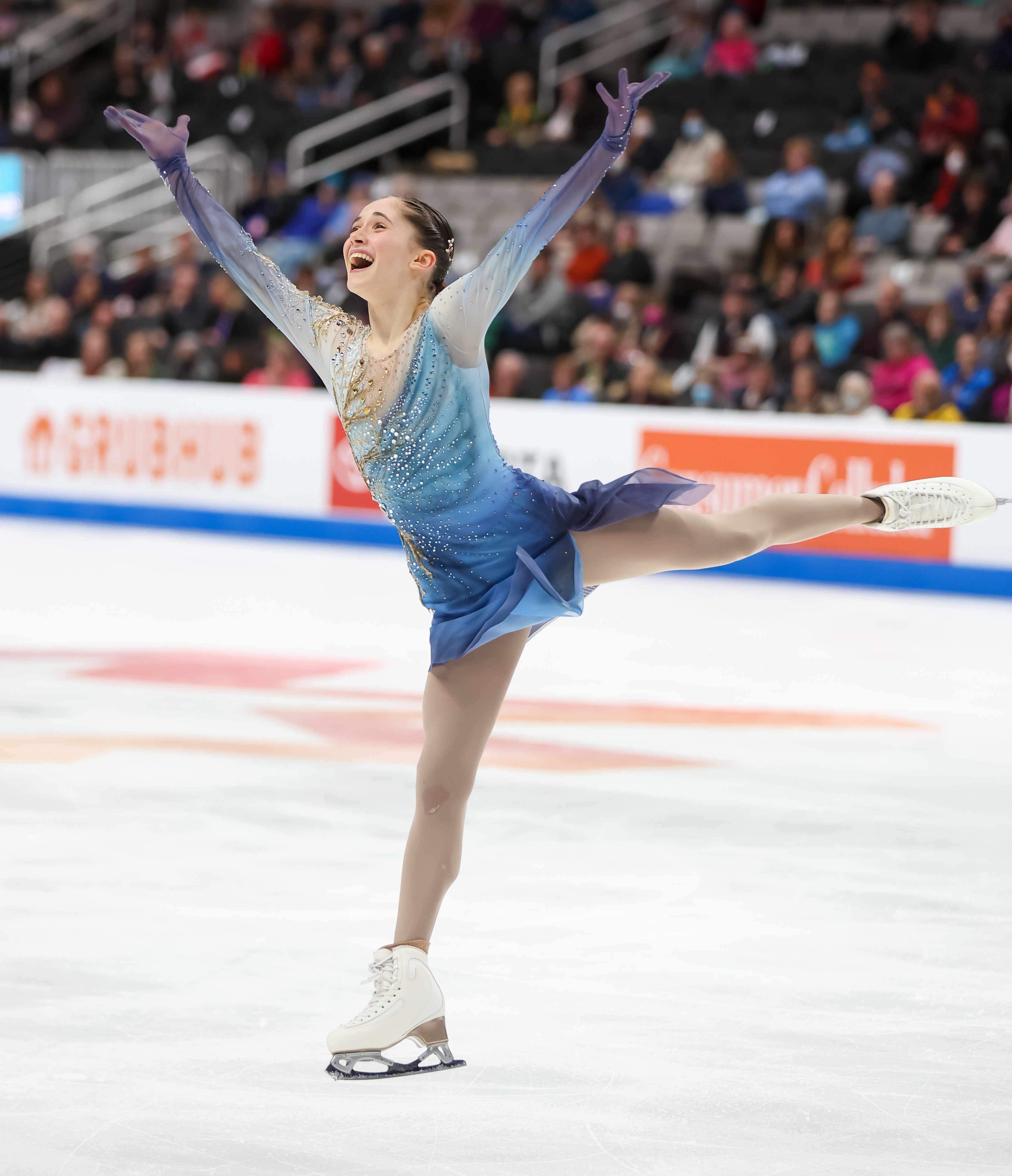 Isabeau Levito competes in the women's free skate at the 2023 U.S. Figure Skating Championships. She skates on one leg with her arms outstretched. 