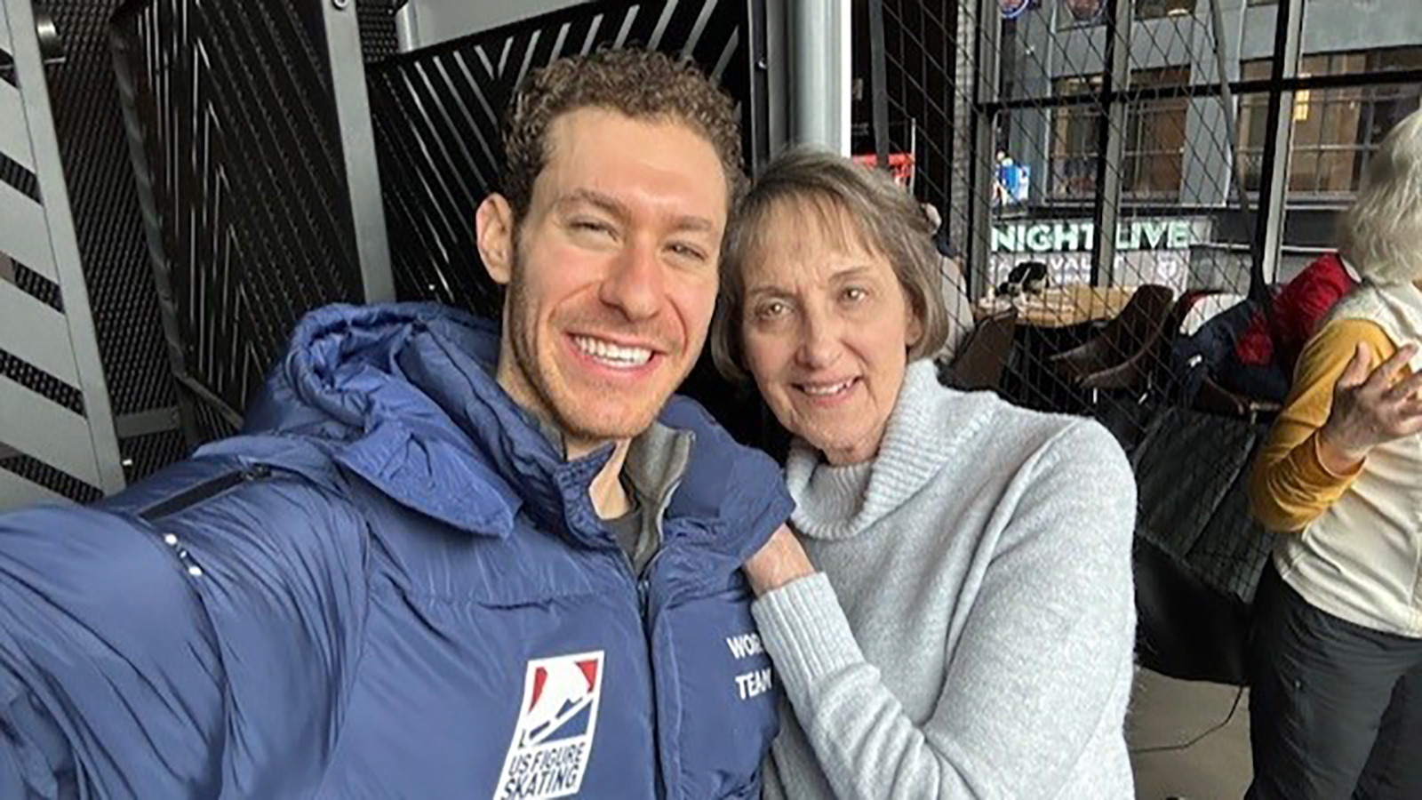 Olympian Jason Brown, wearing U.S. National Team blue jacket, with supporter Janice Collins, wearing a white top
