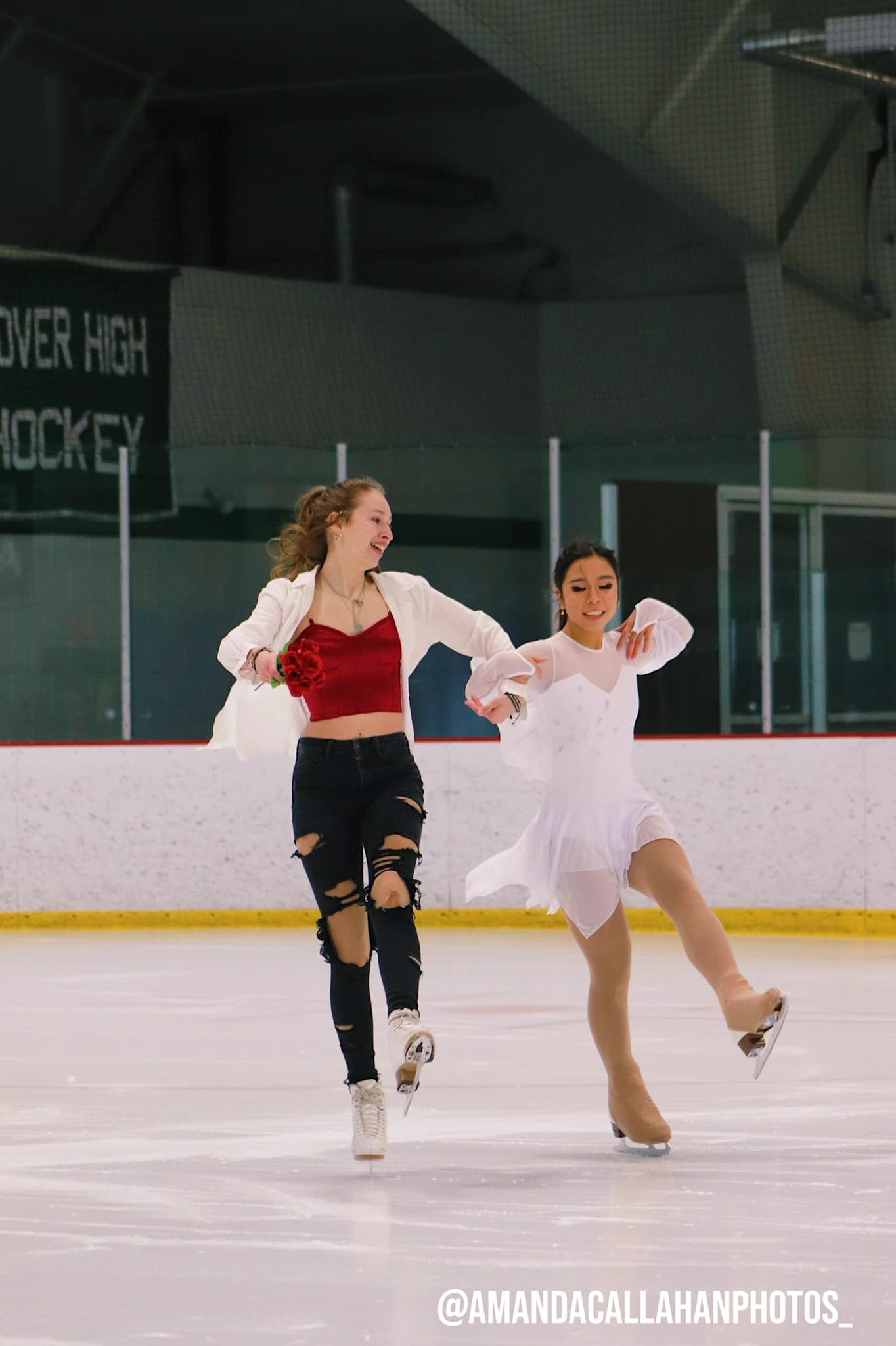 Two skaters in Broadway inspired costumes perform a duet on the ice.