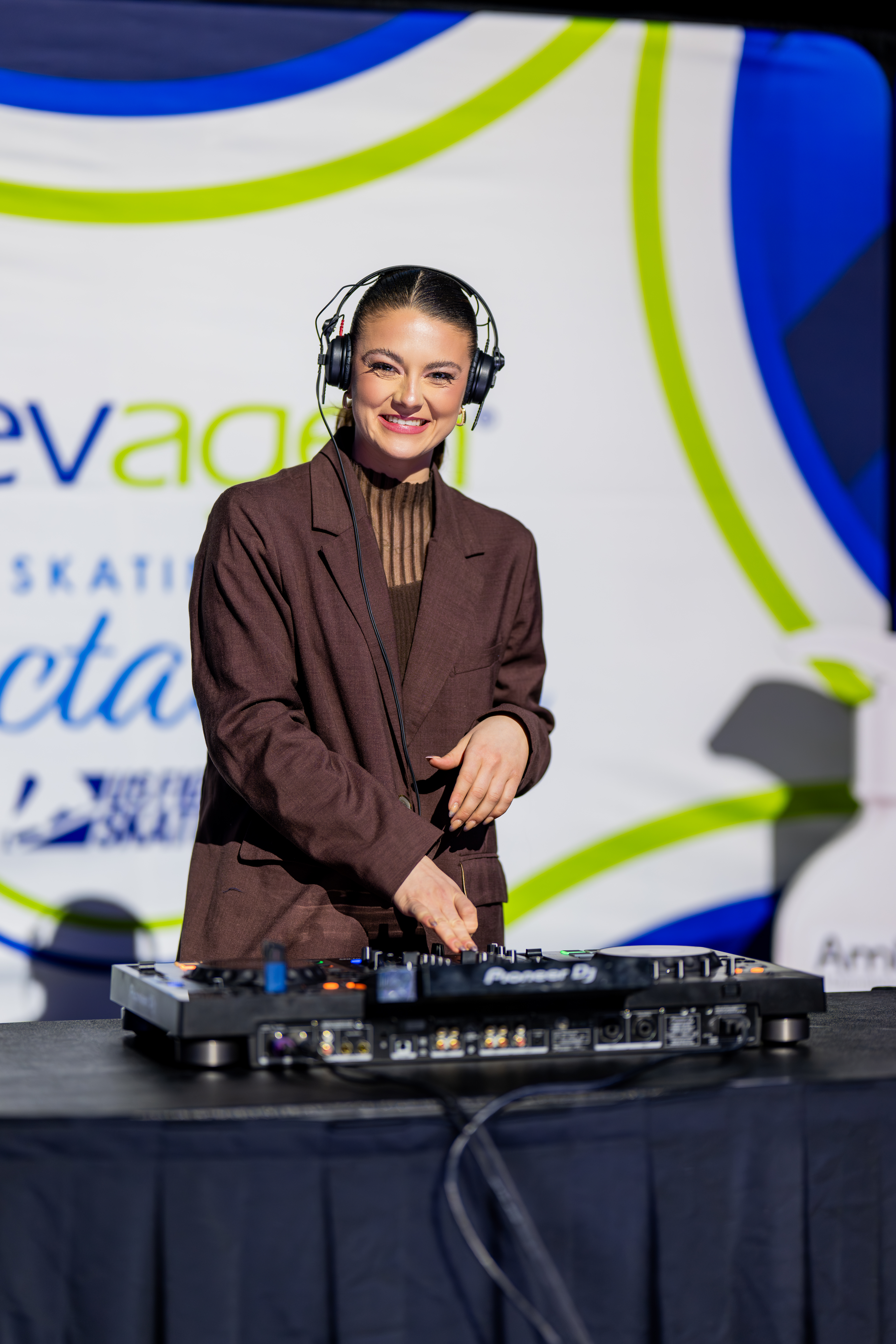 Dressed in all brown, Kaitlin Hawayek works her magic as a DJ during the gala in Wichita.