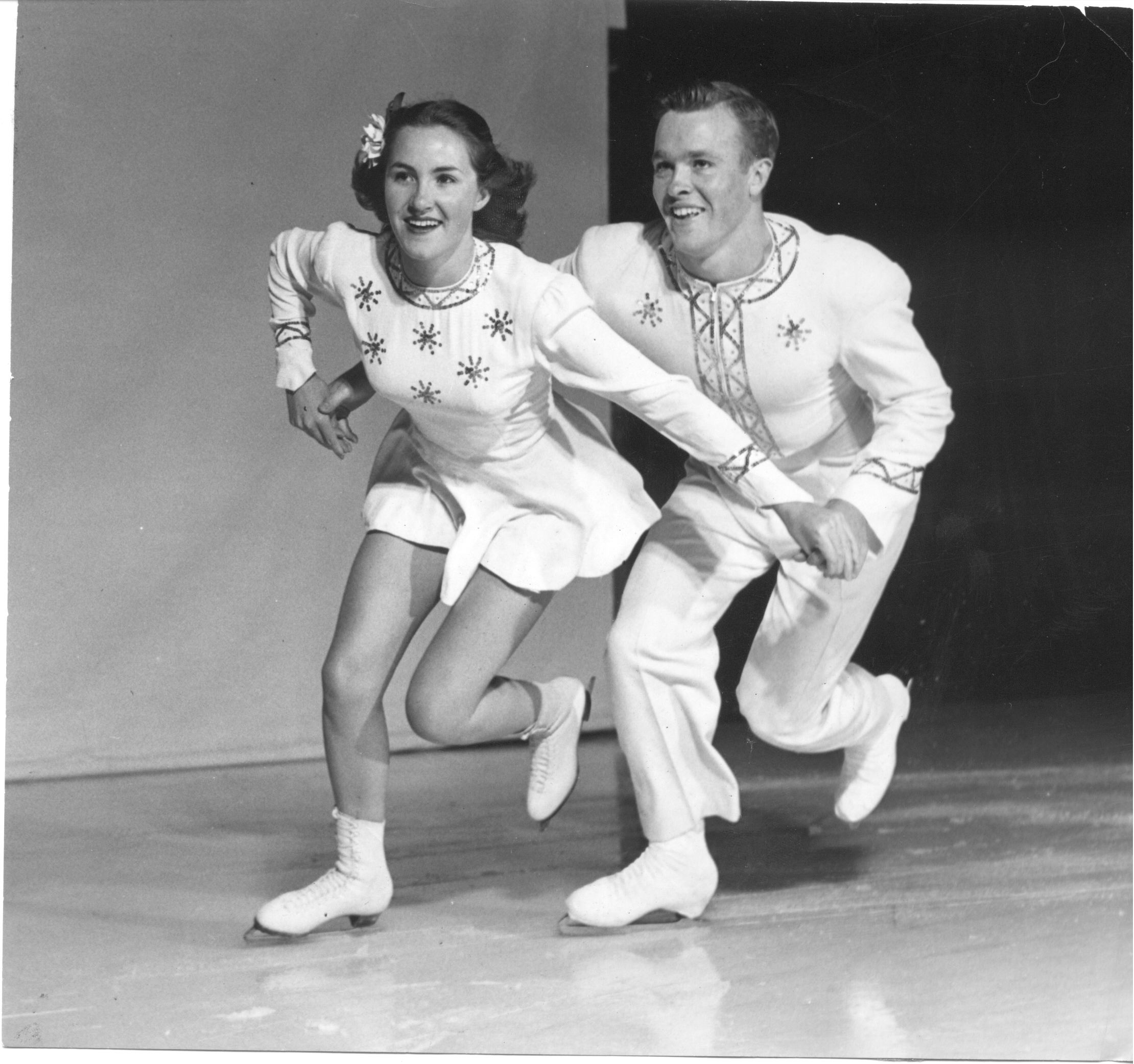 The Kennedys skate together in white costumes