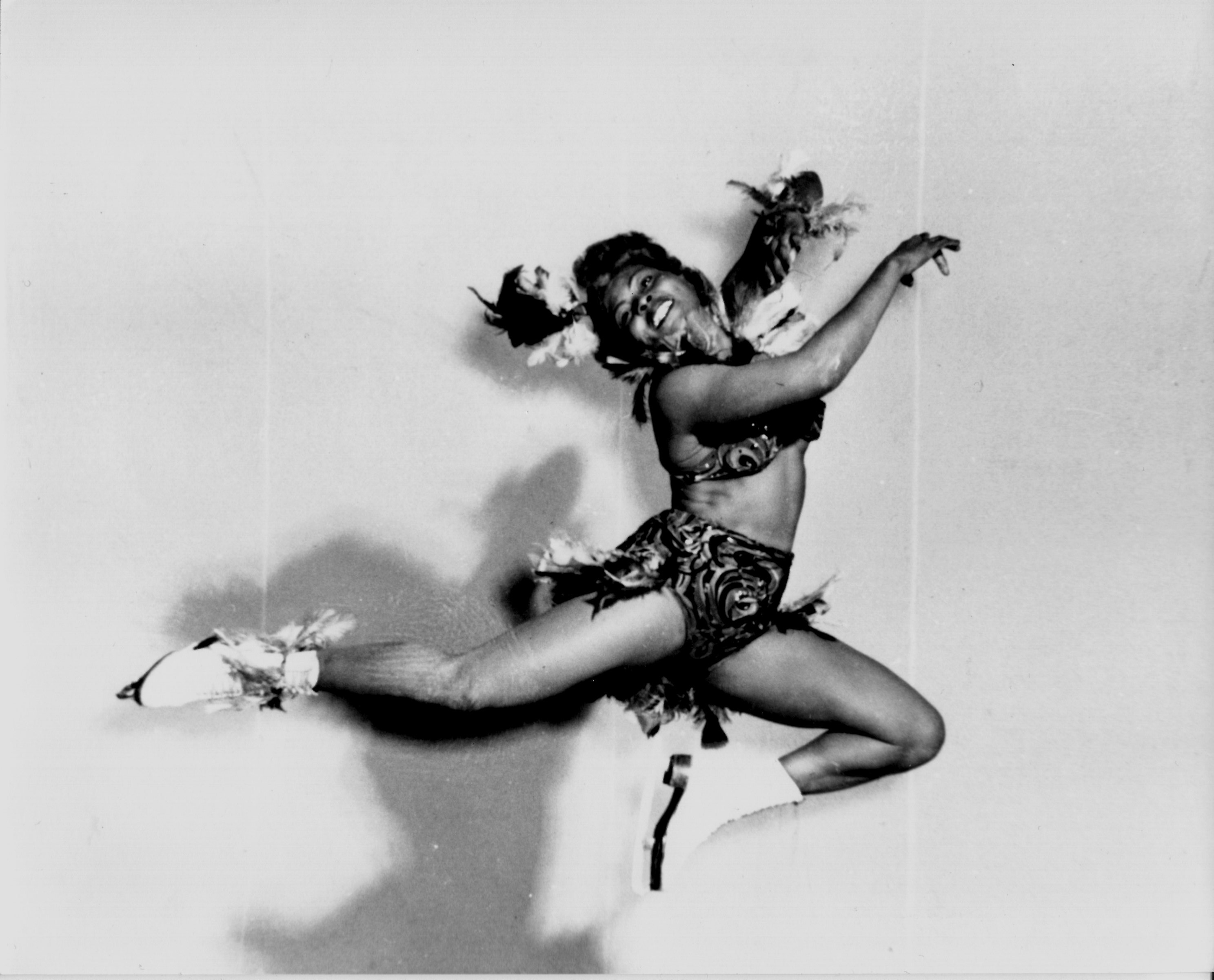 Mabel Fairbanks leaps off the ice in skating costume