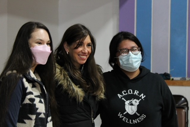 Naomi Lang with two young Native Americans.