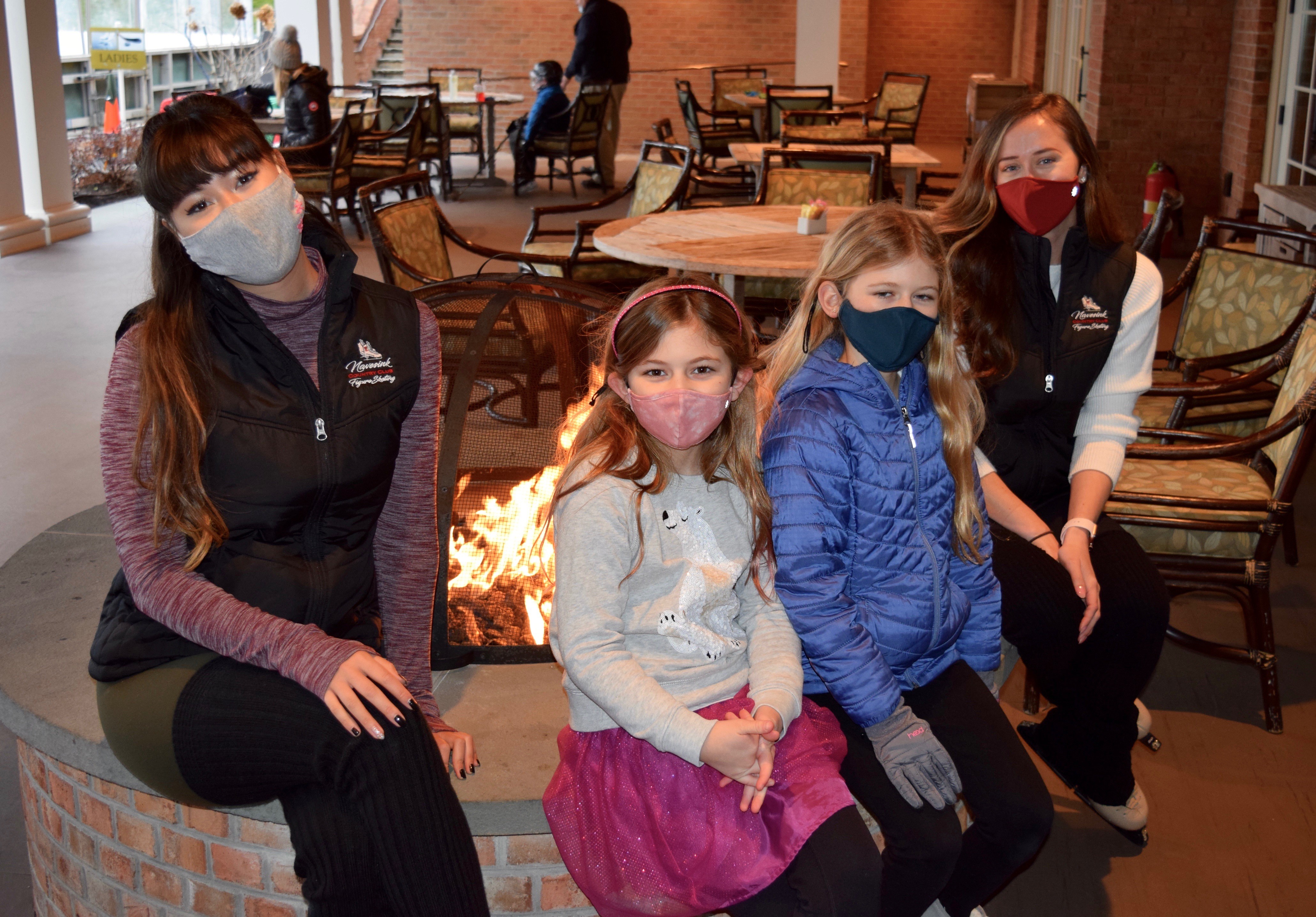 Coaches Mariko Heimbach and Jennifer Gruver spend quality time with students Quinn and Brie Haverstick.