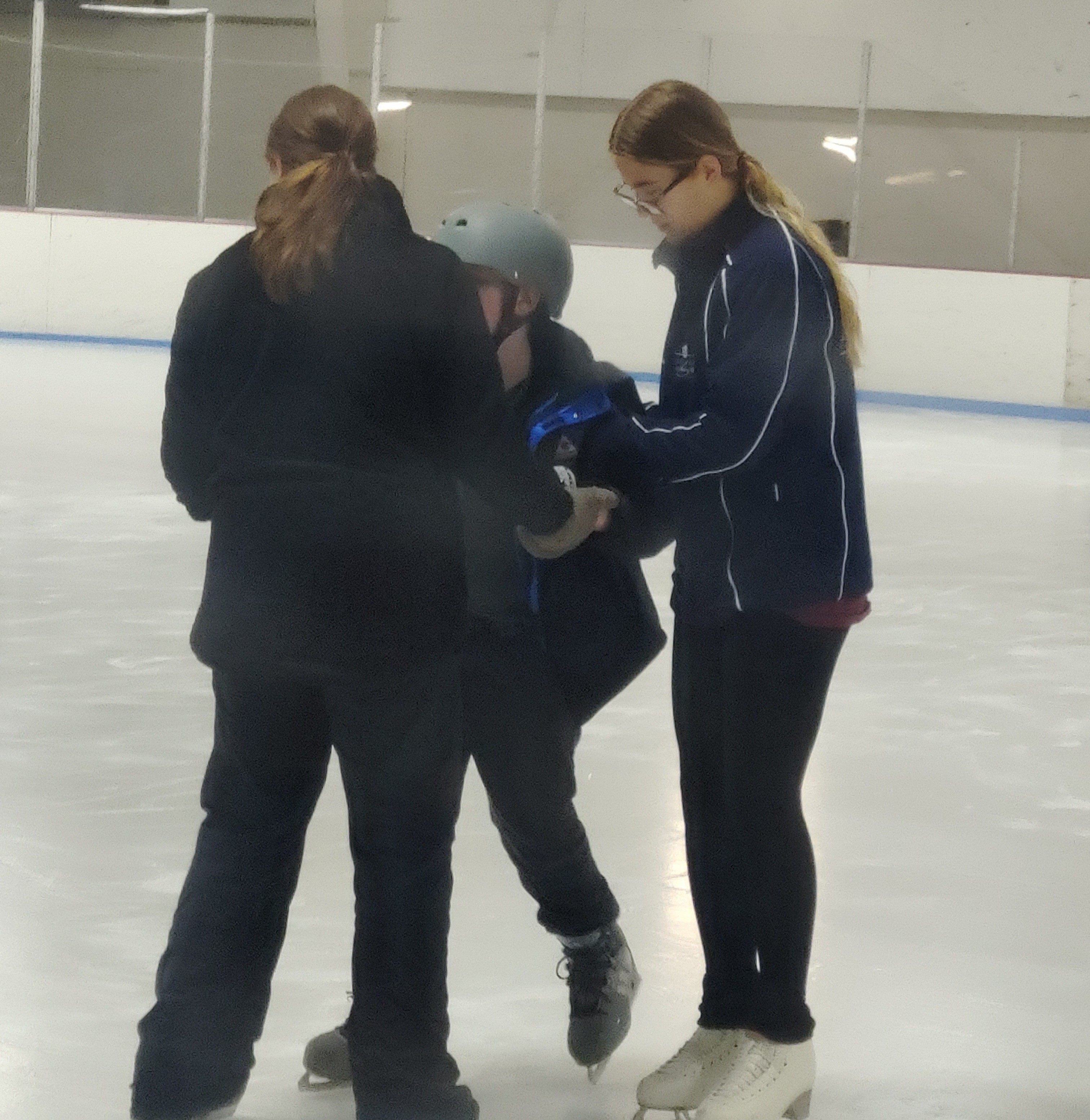 Selena Staab shows Noah how to balance on the ice
