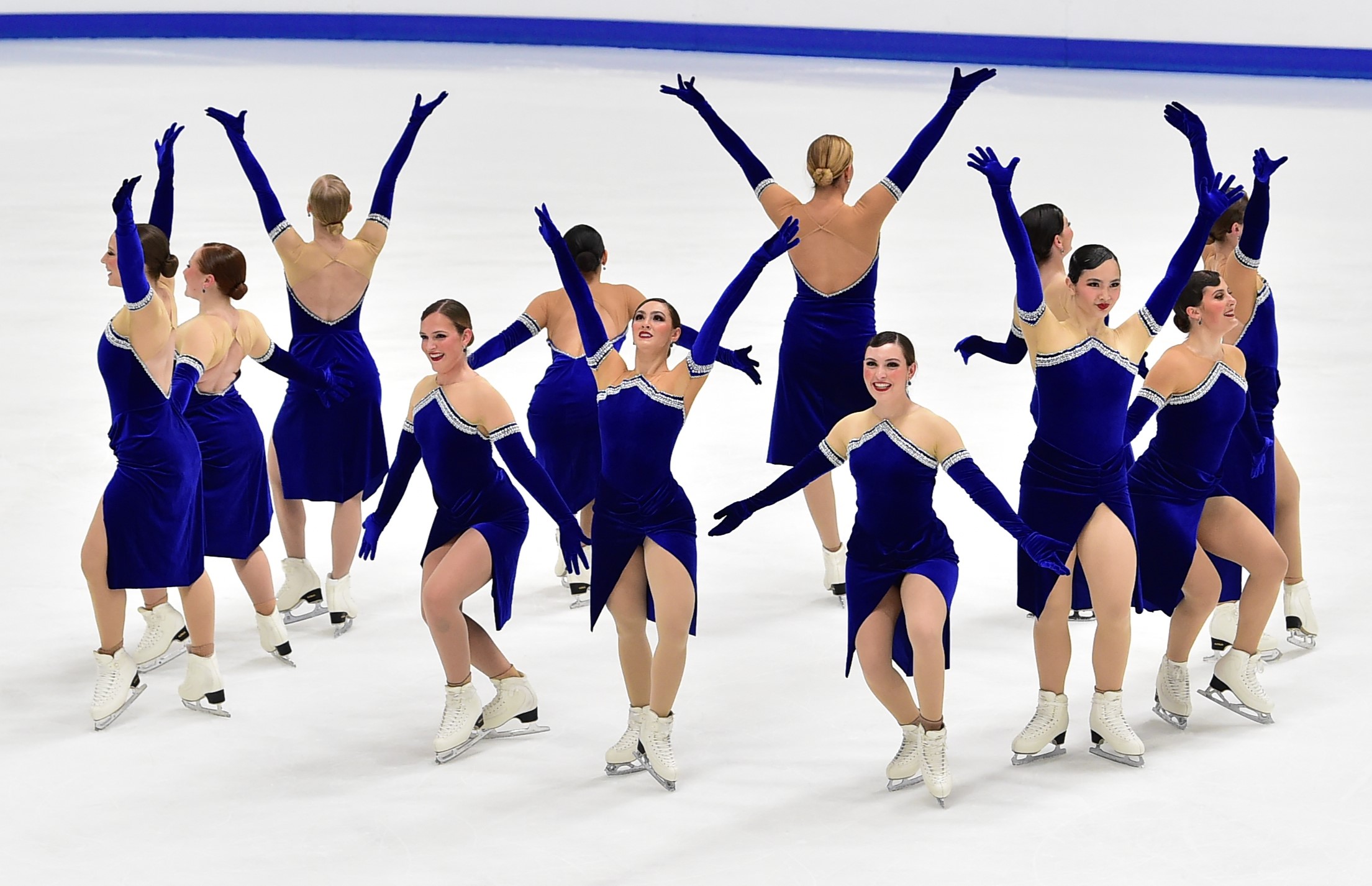 Hayden Select competes in senior elite 12 wearing matching dark blue skating costumes.