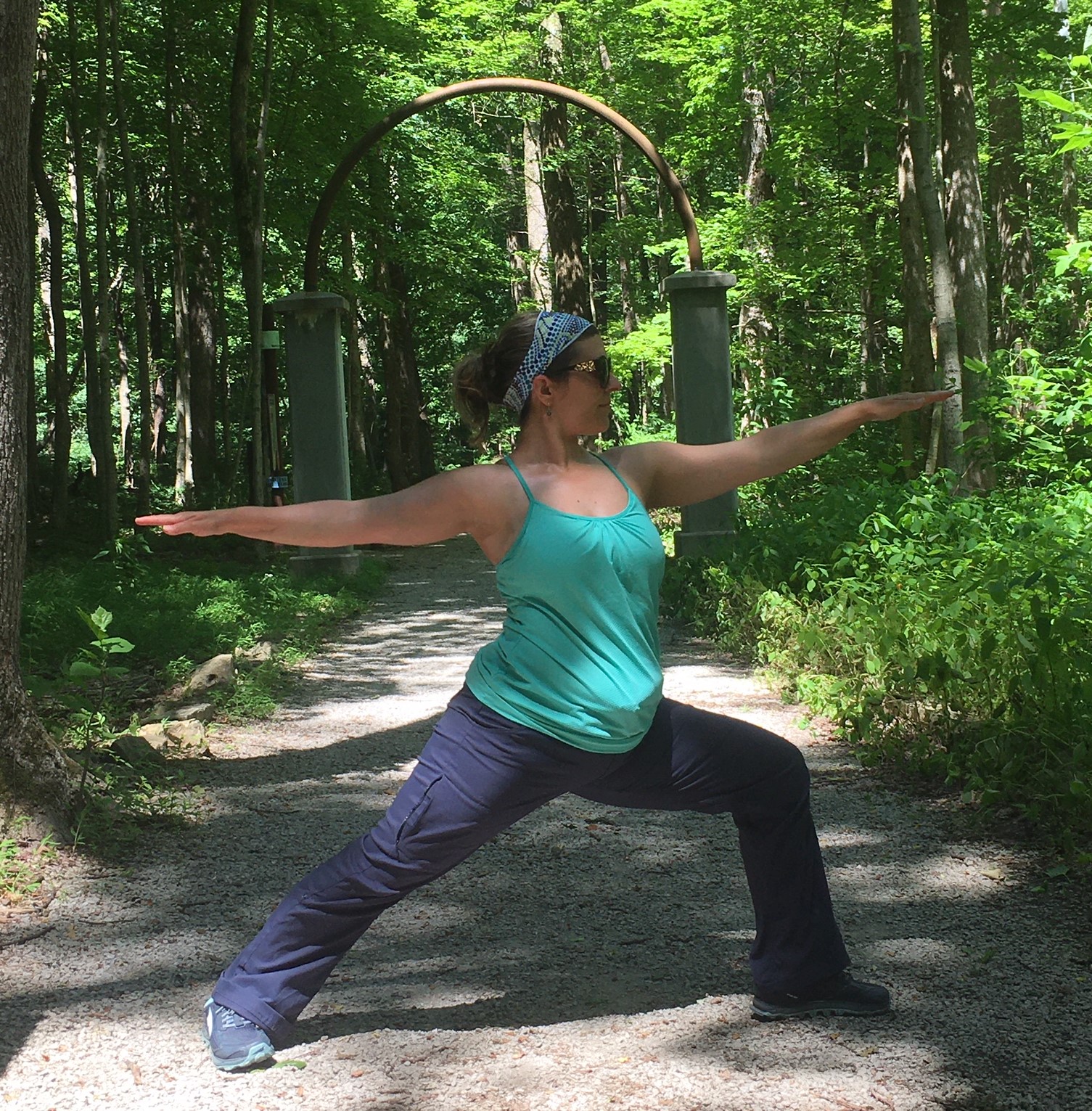 Sarah Neal practices a yoga pose outdoors.