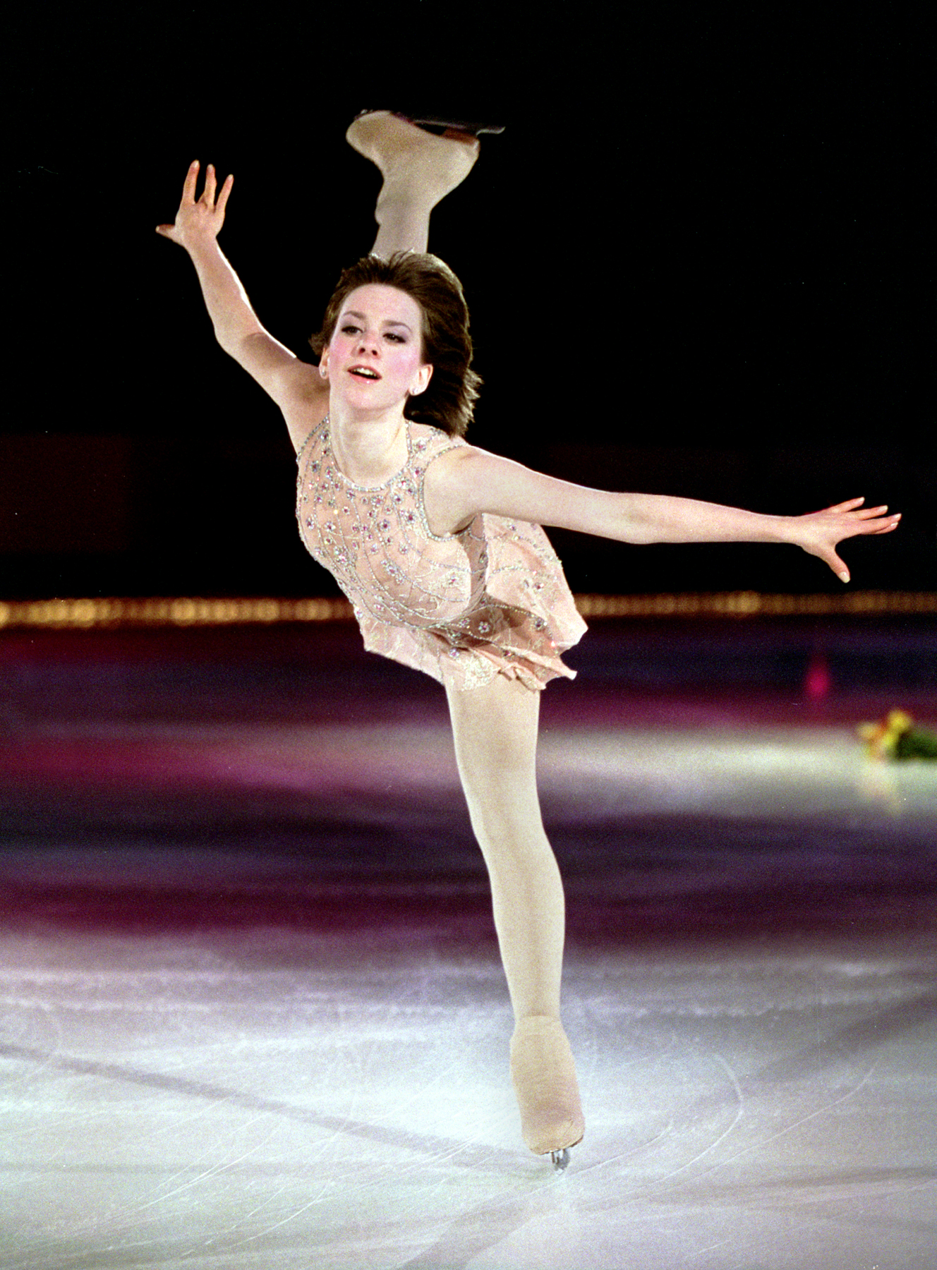 Sarah Hughes performs a spiral under the spotlight
