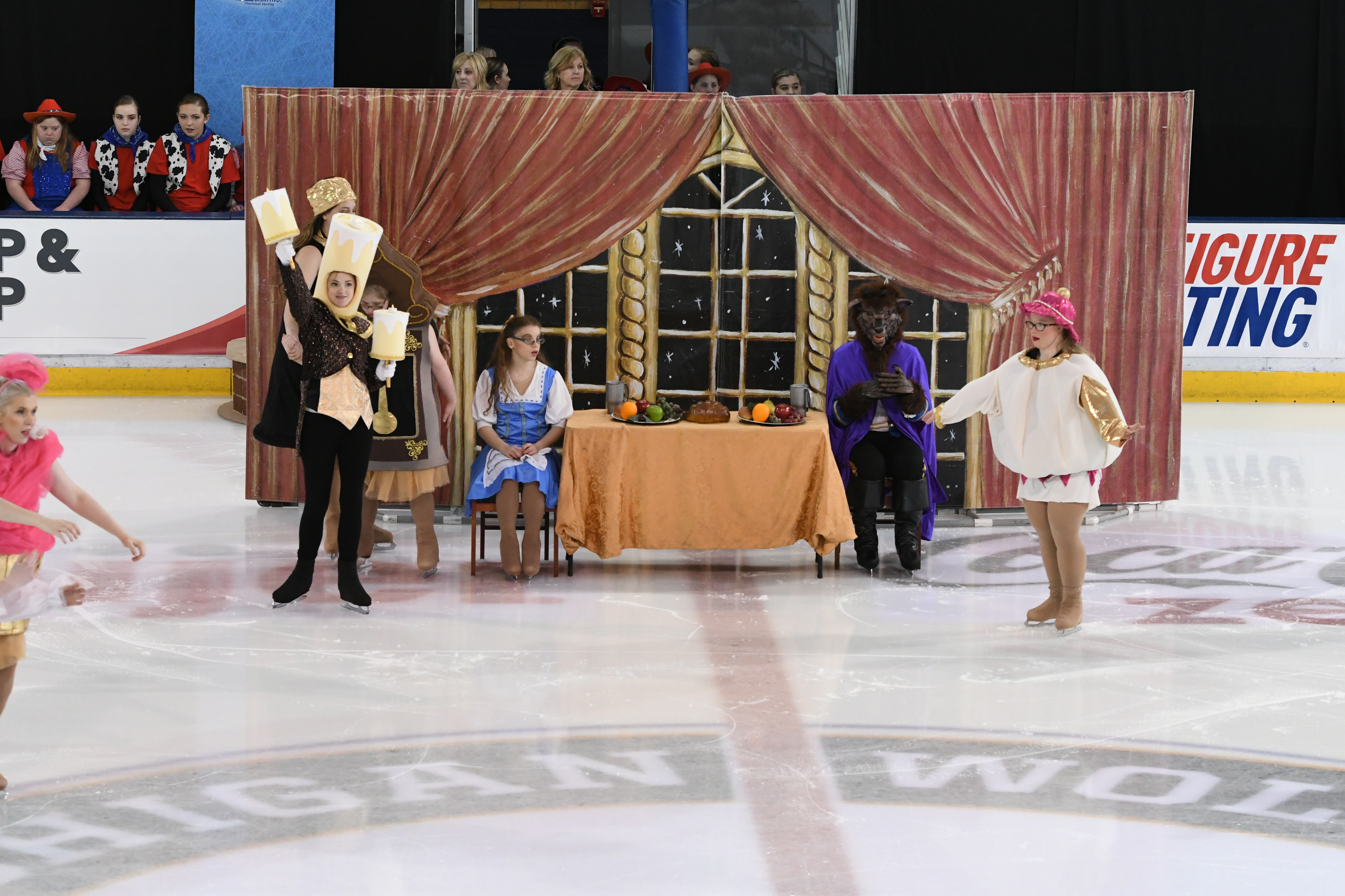 A group of Disney characters perform in front of a specially designed set, complete with curtains and windows.