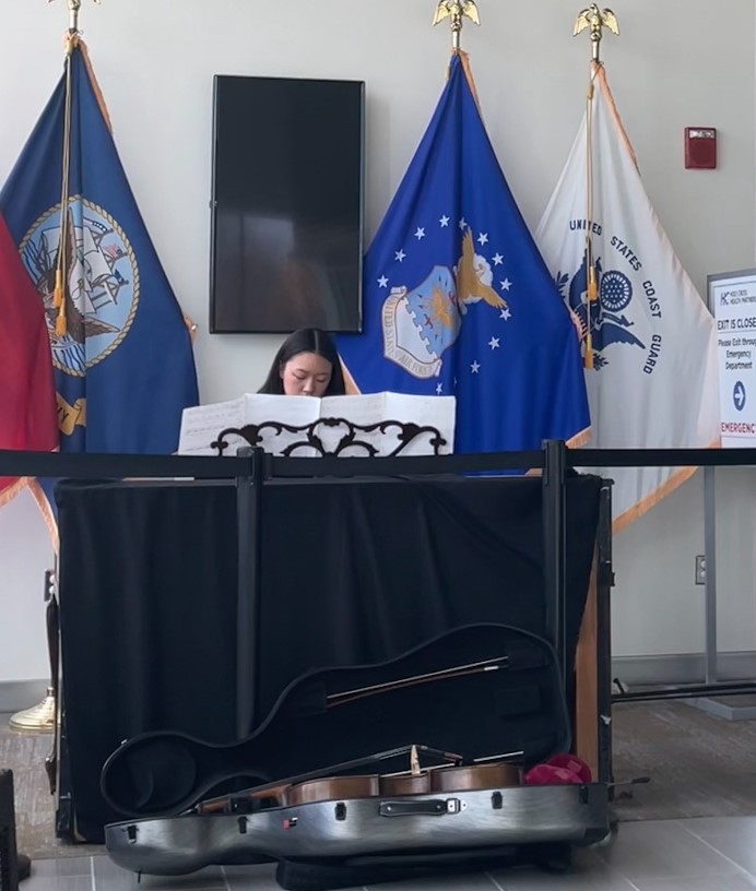Julia Ran plays piano for an area nursing home as part of the Tacy Foundation.