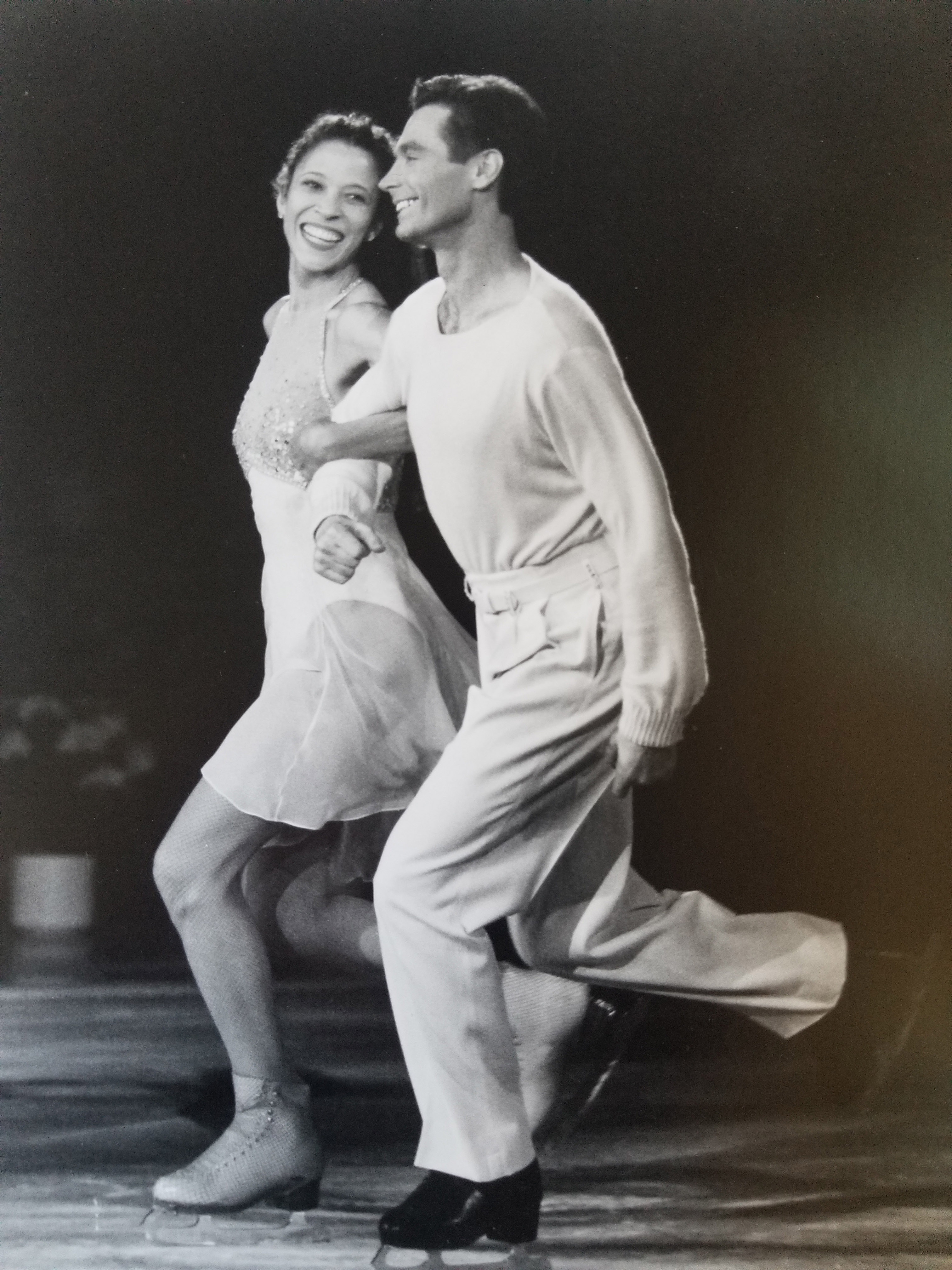 Tai Babilonia and Randy Gardner skate arm in arm