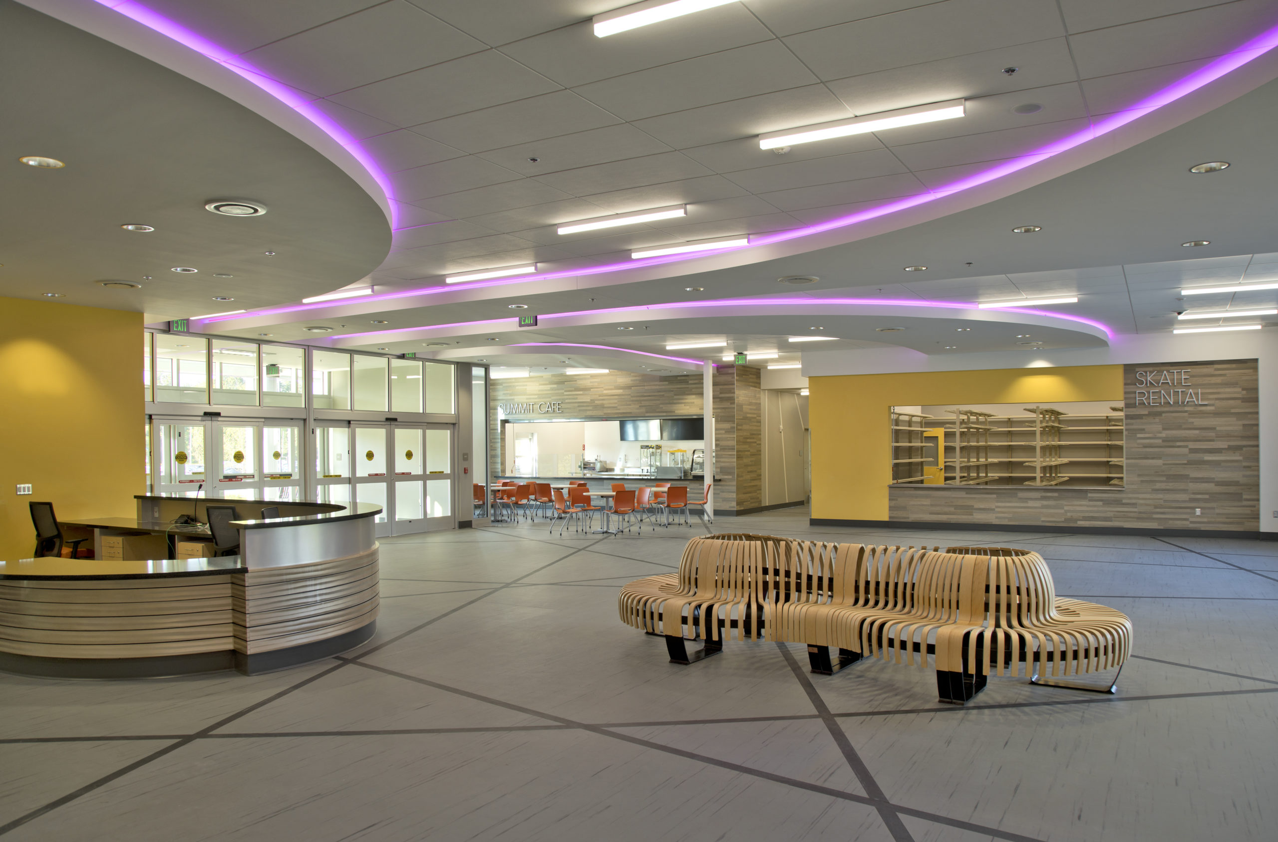 The Tucker Road ice rink lobby features state of the art benches and bright flooring and walls.