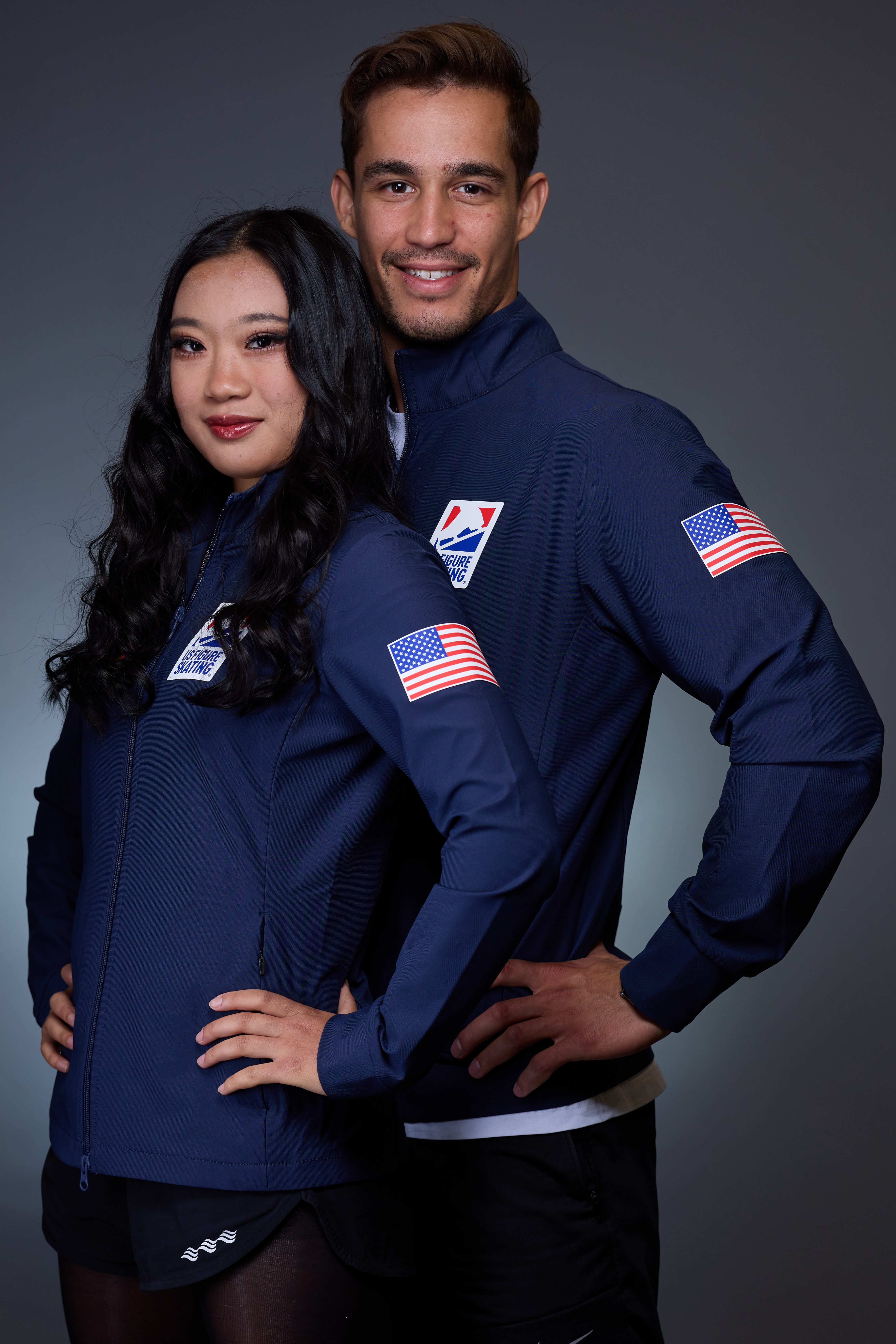Audrey Shin and Balazs Nagy in their U.S. National Team Jackets, standing side by side, arms on hips