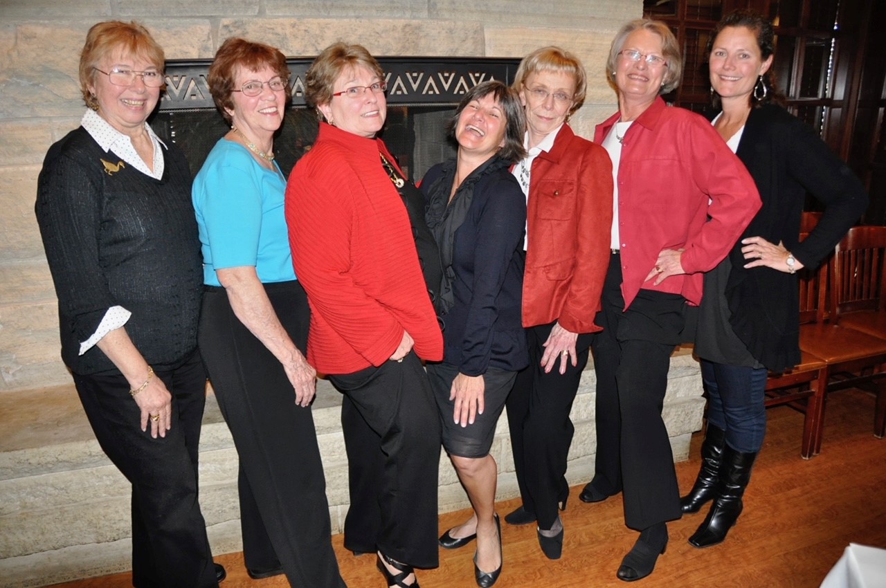 A group of older women from Wendy's Lunch Bunch pose off the ice.