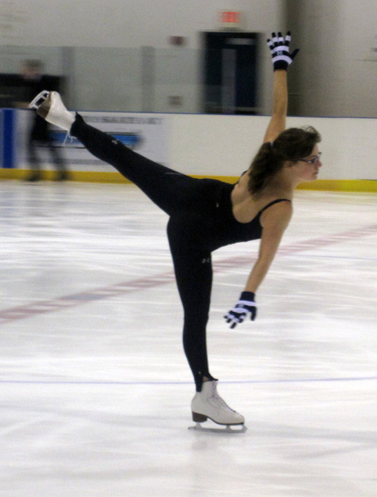 Adult skater Patrice Hutton glides on one foot around the Wichita Ice Center in 2010.in