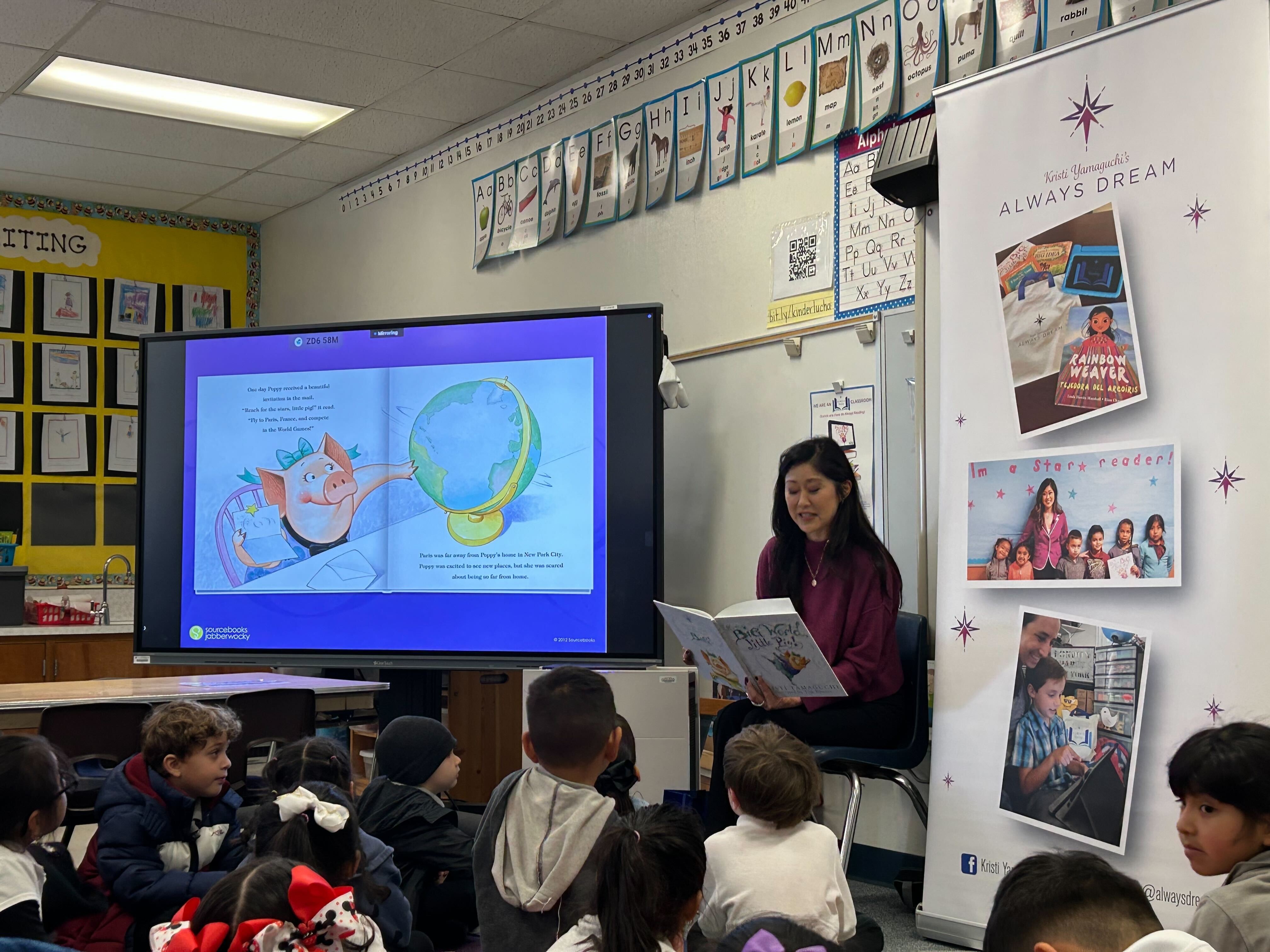 Kristi Yamaguchi shares her love of reading with a classroom of young pupils.