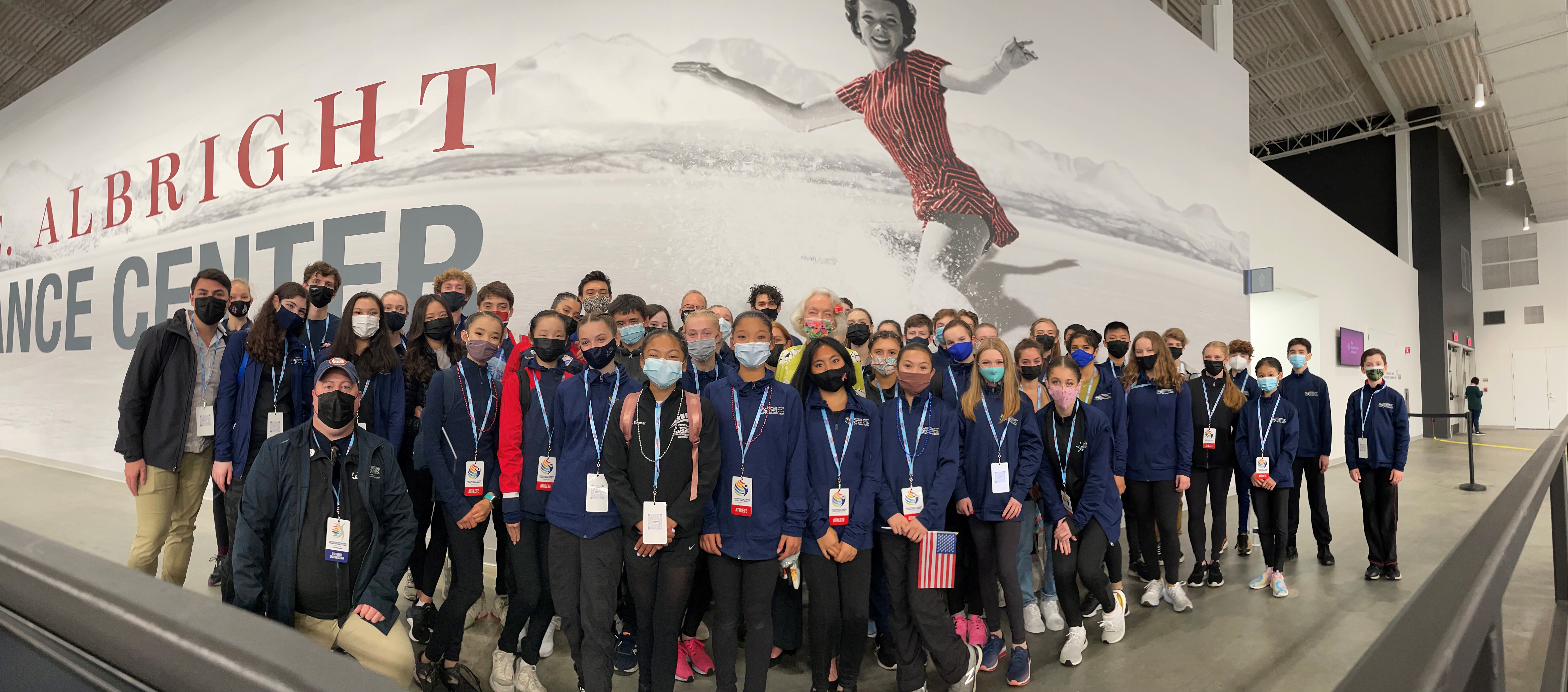 The Challenge Skate competitors in a group with Madison Hubbell