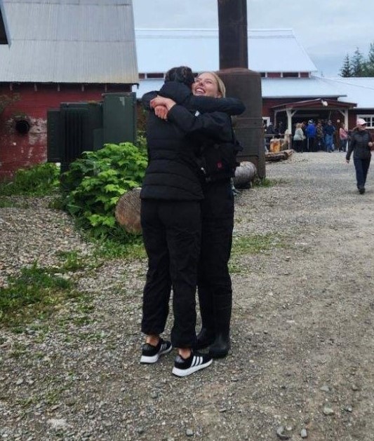Jessie and Lisa hugging after Jessie was given her papers