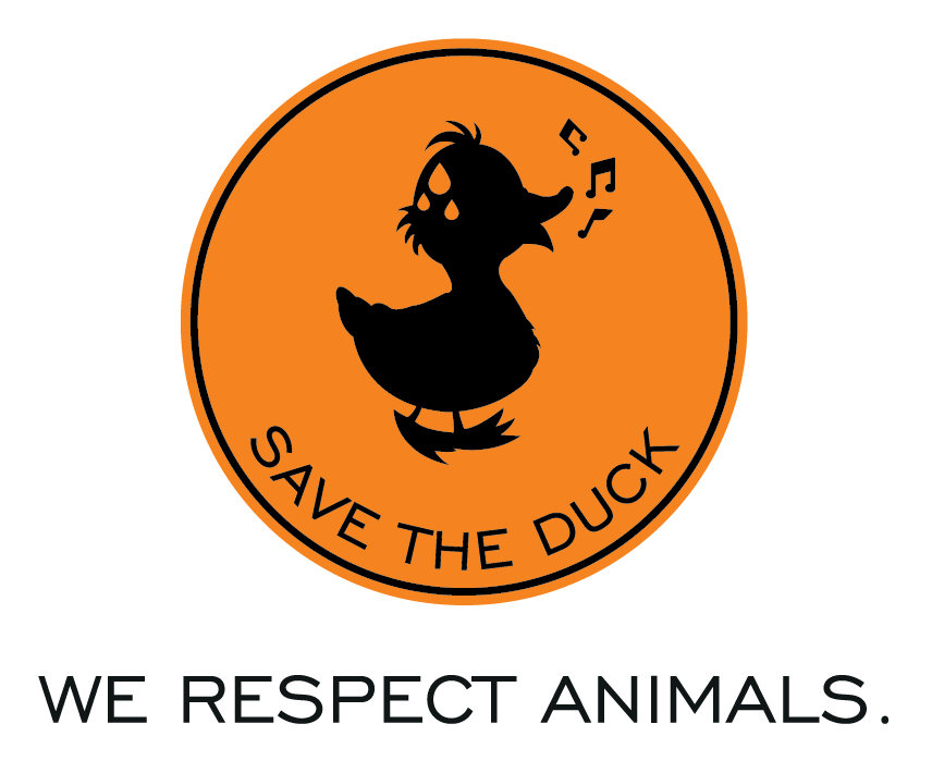 Save The Duck logo. The logo is an orange circle with a blue outline of a duck with the text "Save The Duck" at the bottom