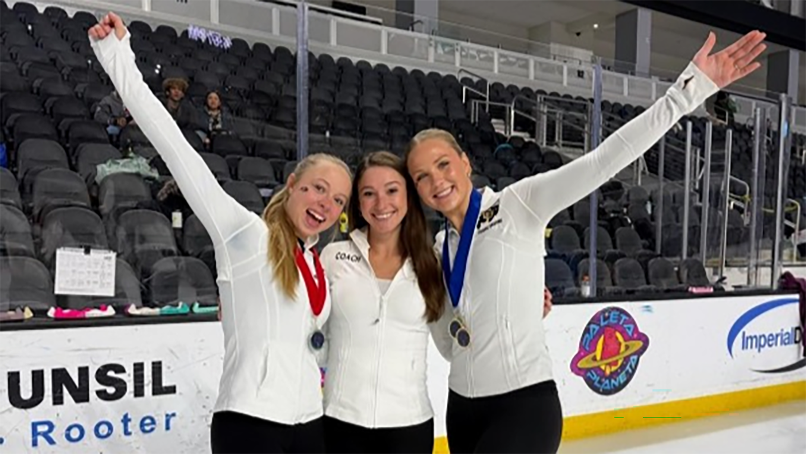 CU Figure Skating team members Emma Cumming, coach Courtney Wetterich and Kendall Taulbee, dressed in white tops and black pants, celebrate after their qualification to the National Intercollegiate Final.