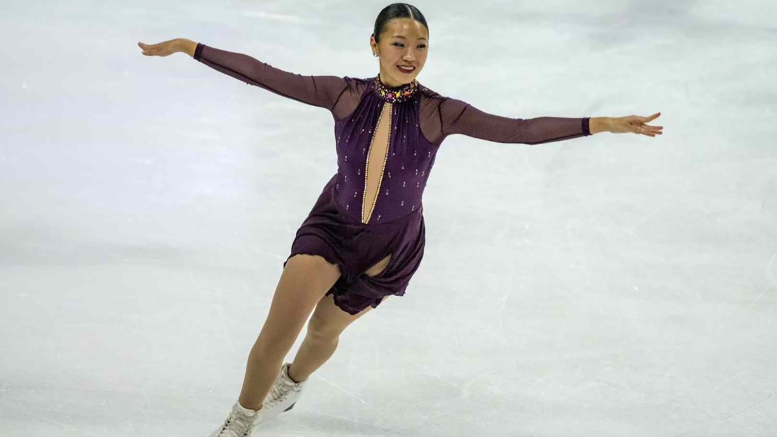 Julia Ran, arms extended to the side, performs for DC Edge