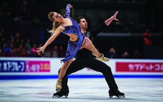 Madison Hubbell stands on Zachary Donohue's right foot while performing a lift.