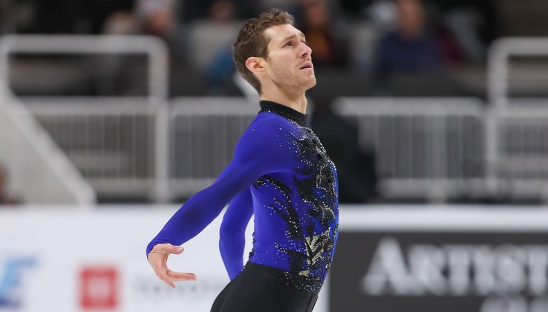 Jason Brown, dressed in a blue and black trop, shown from the waist up, has his arms behind him, an emotional look on his face as he looks up while skating at last year's U.S. Championships.