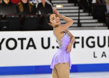 Karen Chen performs with heartfelt emotion in a light purple dress.