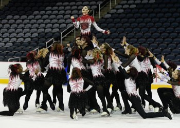 Wearing red and black, the Space Coast Hurricanes open TOI team performs a winning  Jekyll and Hyde program at the 2024 Nations Cup.