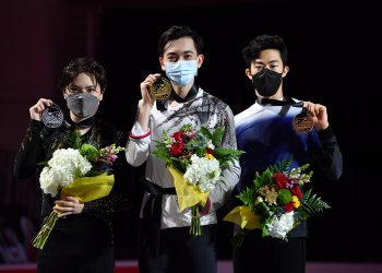 Shoma Uno, Vincent Zhou, and Nathan Chen in masks on the podium at 2021 Skate America.