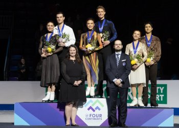 The 2023 Four Continents ice dance podium with the ward presenters (including Tracey Marek, U.S. Figure Skating's CEO on the bottom left)