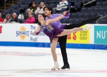Dressed in purple, Olivia Flores and Luke Wang glide side by side. 