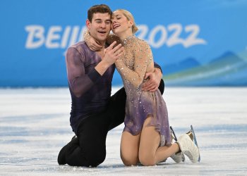 Alexa Knierim and Brandon Frazier kneeling on the ice at the end of their free skate at the Olympic Winter Games Beijing 2022.