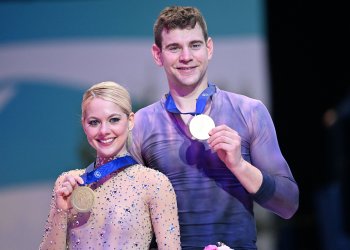 Alexa Knierim and Brandon Frazier pose with their medals at the 2022 World Figure Skating Championships